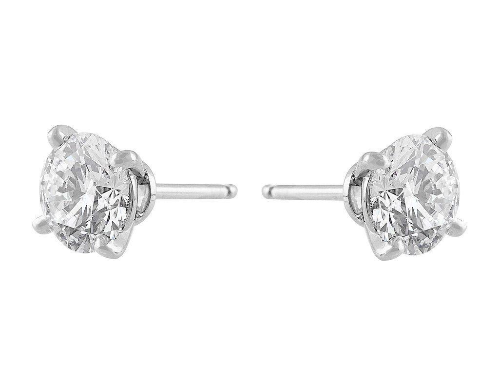 Absolutely beautiful estate Cartier 3 carat Diamond Stud Earrings. Each diamond is GIA certified weighing 1.50 carats with excellent polish, symmetry and cut. One diamond has H color and the other has G color, both diamonds are VVS2 clarity.