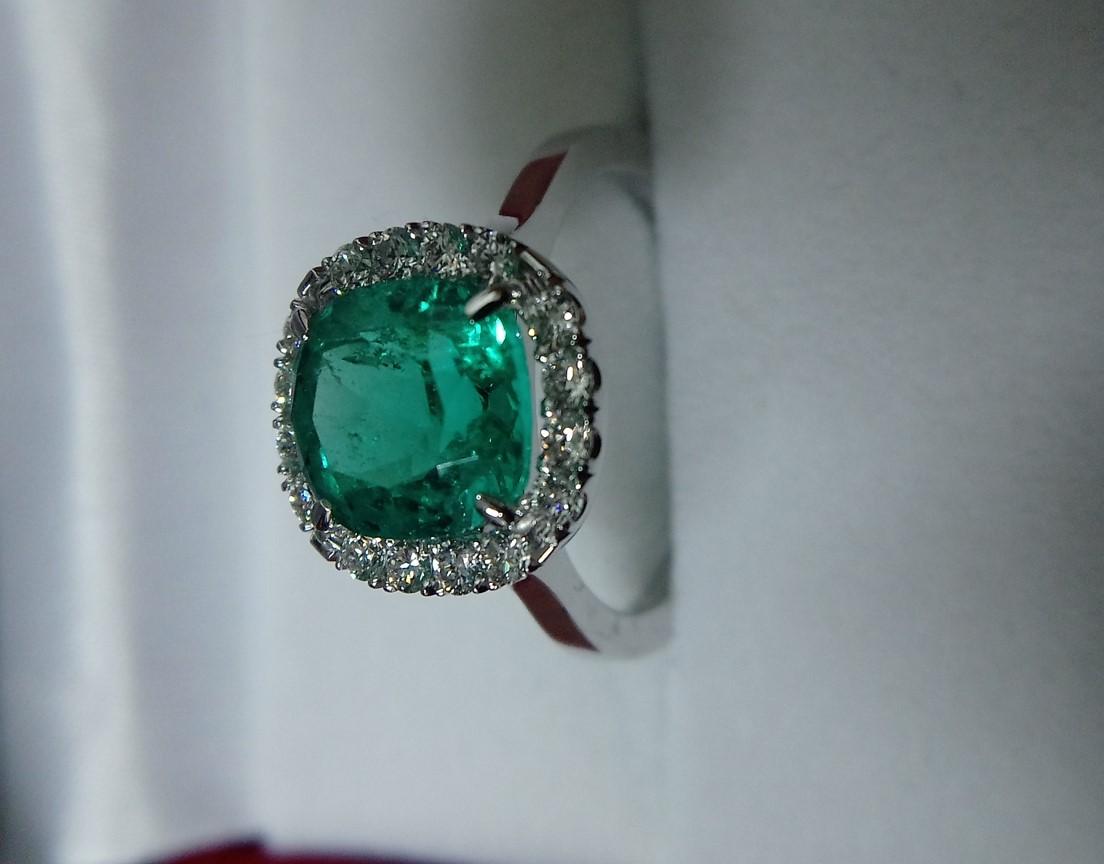 Emerald Cut 3 Carat Colombian Emerald with Diamond Halo Ring For Sale
