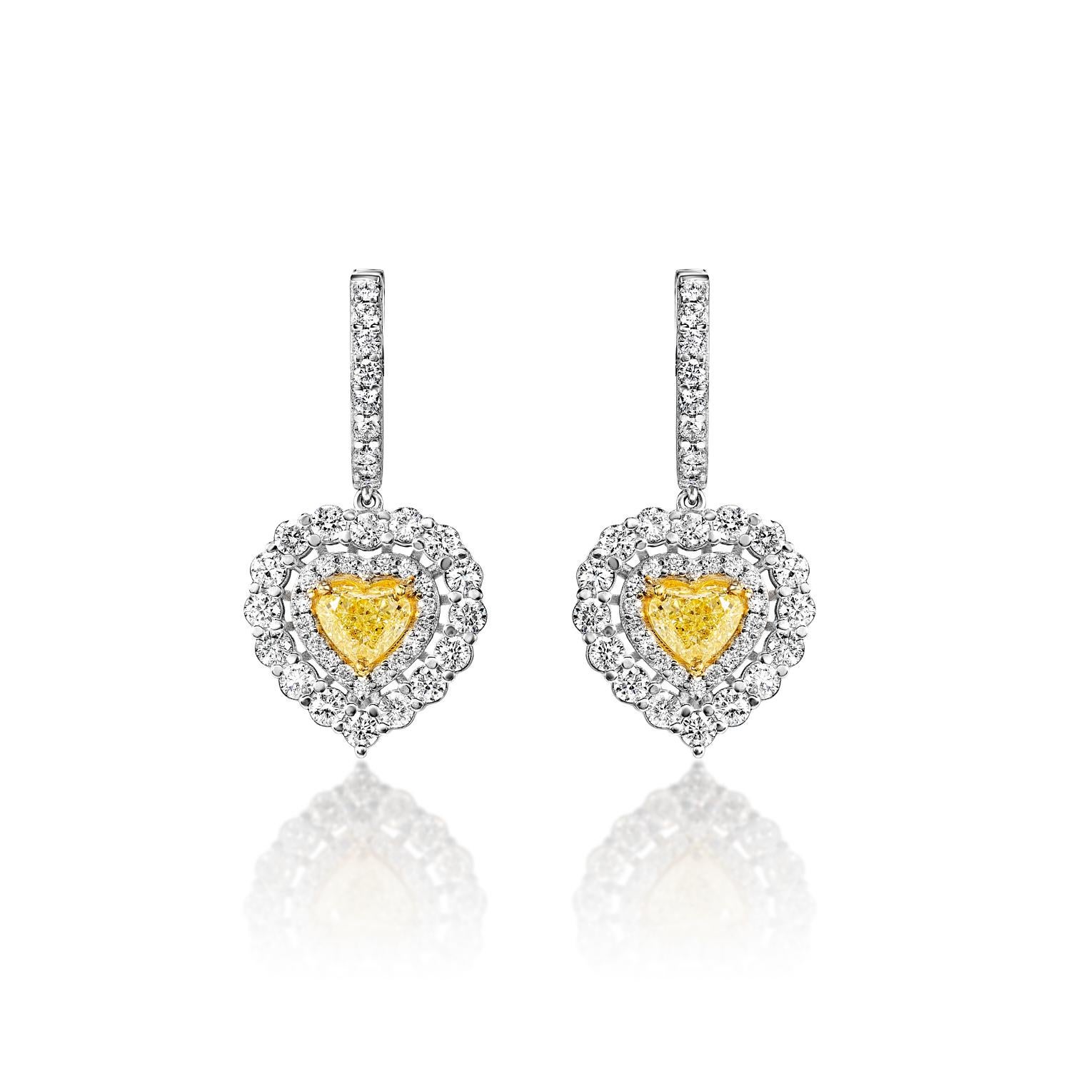 Heart Diamond Hanging Earrings For Ladies:

Main Diamonds:
Carat Weight: 2.78 Carats
Color: Yellow
Shape: Combine Mix Shape (CMB)

Metal: 14 Karat White Gold
Setting: Halo, Shared Prong & 3 Round Prong
Style: Hanging Earrings

Total Carat Weight:
