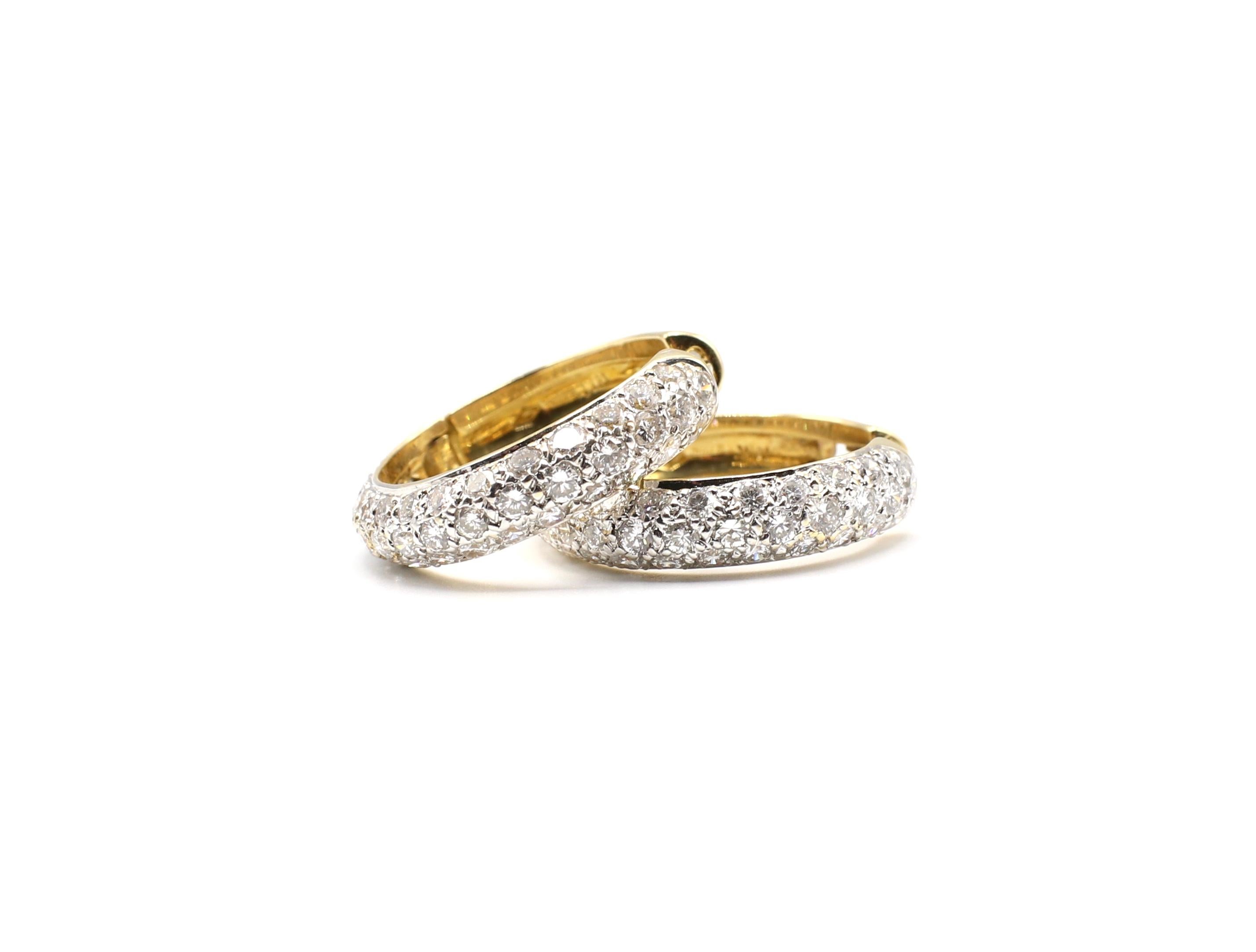 3 Carat Diamond 18 Karat Yellow Gold Hoop Drop Earrings 

Metal: 18K Yellow Gold 750
Weight: 9.5 grams
Earrings measure approx. 4.88mm thick and 21.4mm in diameter
86 round diamonds measure approx. 3.00 ctw color is G-H clarity is VS
Stamped: 