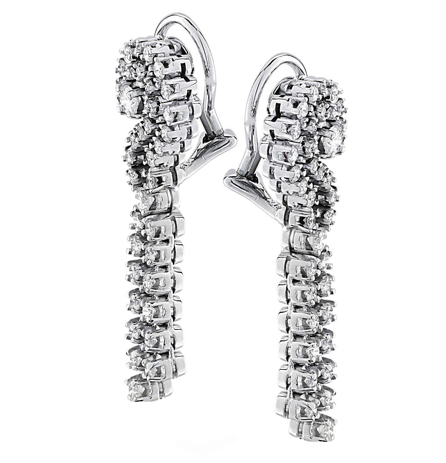 Dazzling diamond dangle clip-on earrings crafted in white gold, featuring 76 round brilliant cut diamonds weighing approximately 3 carats total, G color, VS-SI clarity. These stunning earrings measure 1.6 inches in length, .5 inches in width and