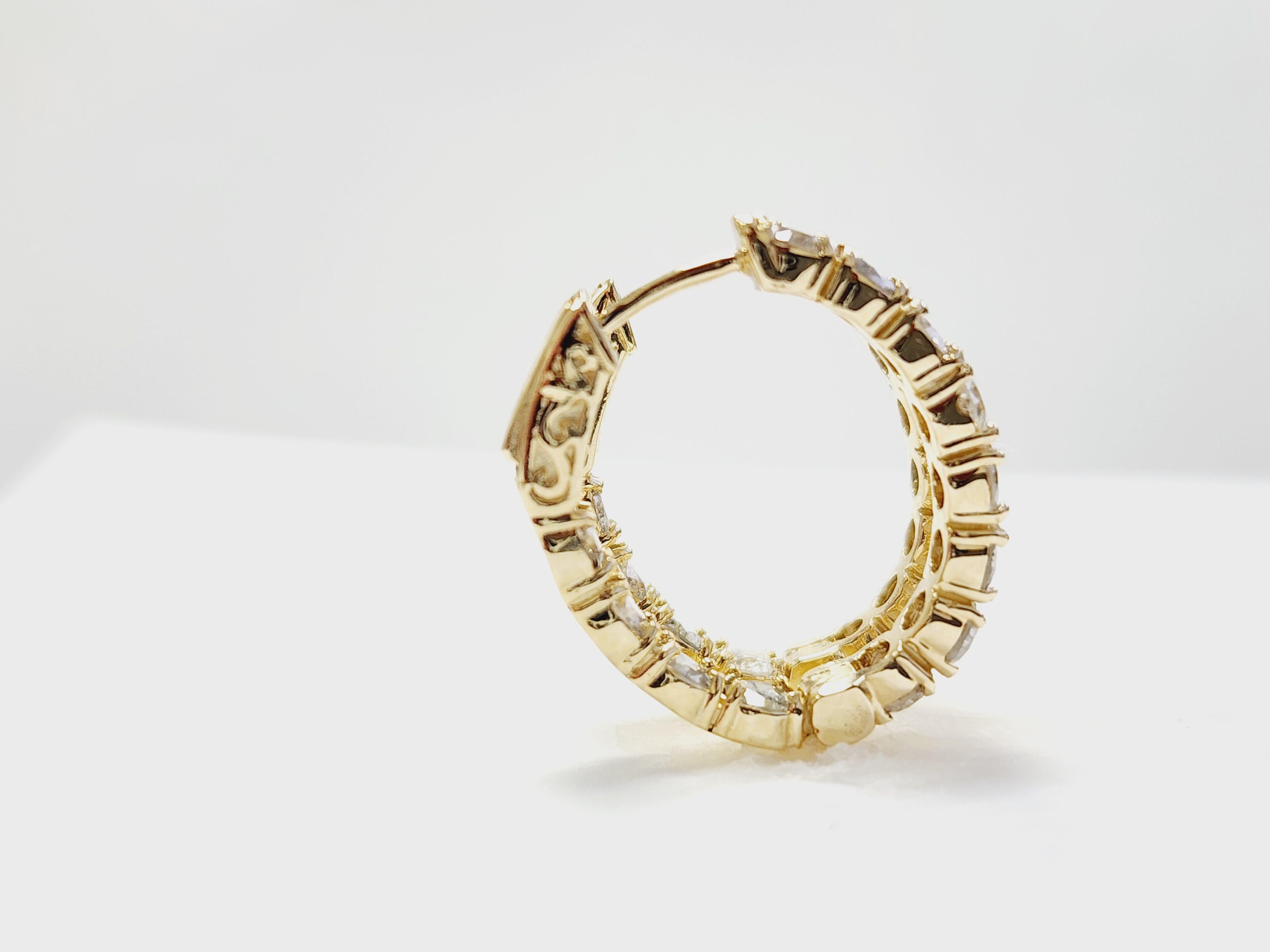 Beautiful pair of natural diamond inside out oval hoop earrings in 14k yellow gold. 
Secures with snap closure for wear. 24 pieces Average Color G, Clarity I, Measures 0.75 inch. 6.46 grams
*Free shipping within the U.S*