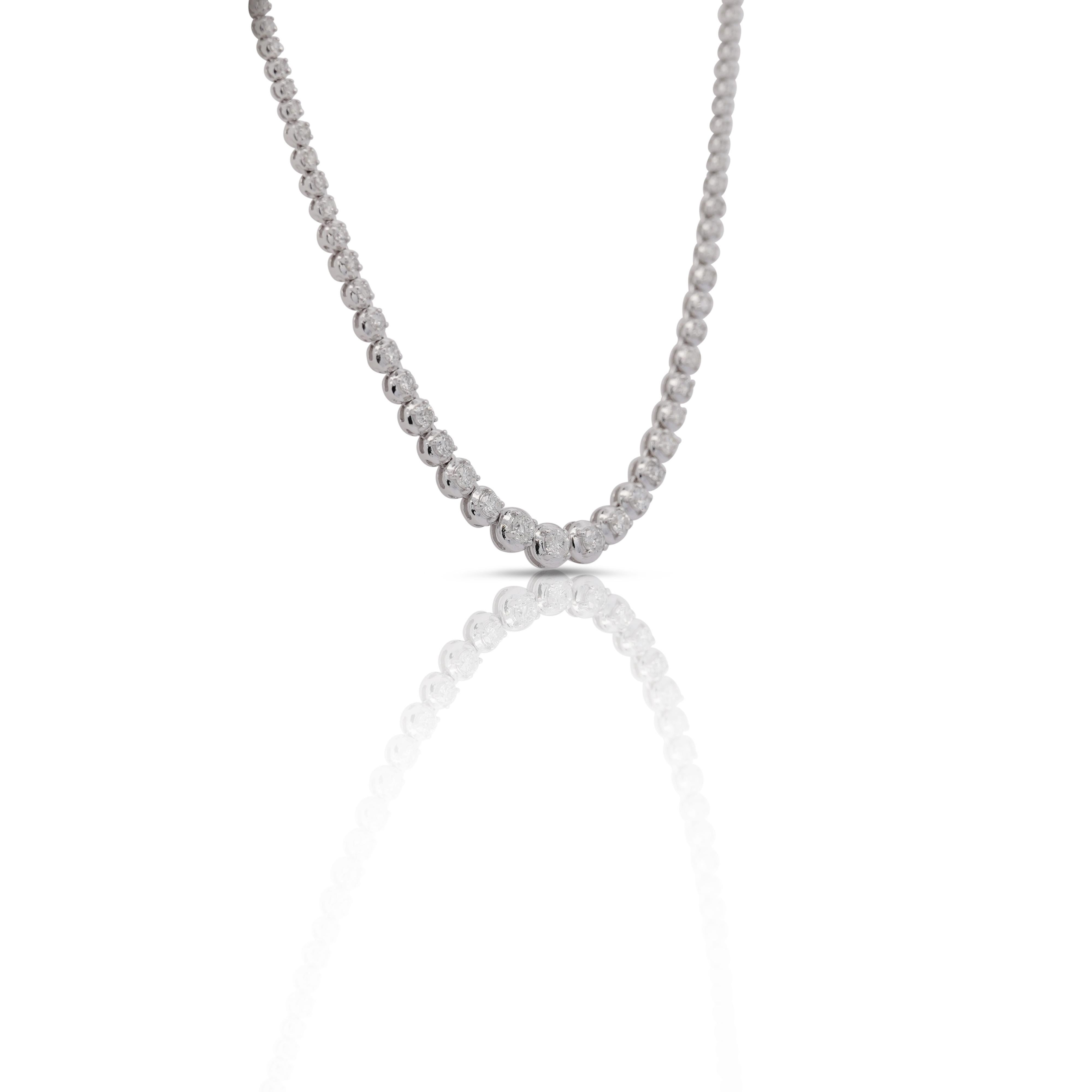 3 Carat Total Natural Diamond Riviera Graduated Tennis Necklace in 18k White Gold and Platinum. Gorgeous everyday tennis necklace with round cut, prong set diamonds all across the length surrounded by 18k white gold. Featuring a box chain on the