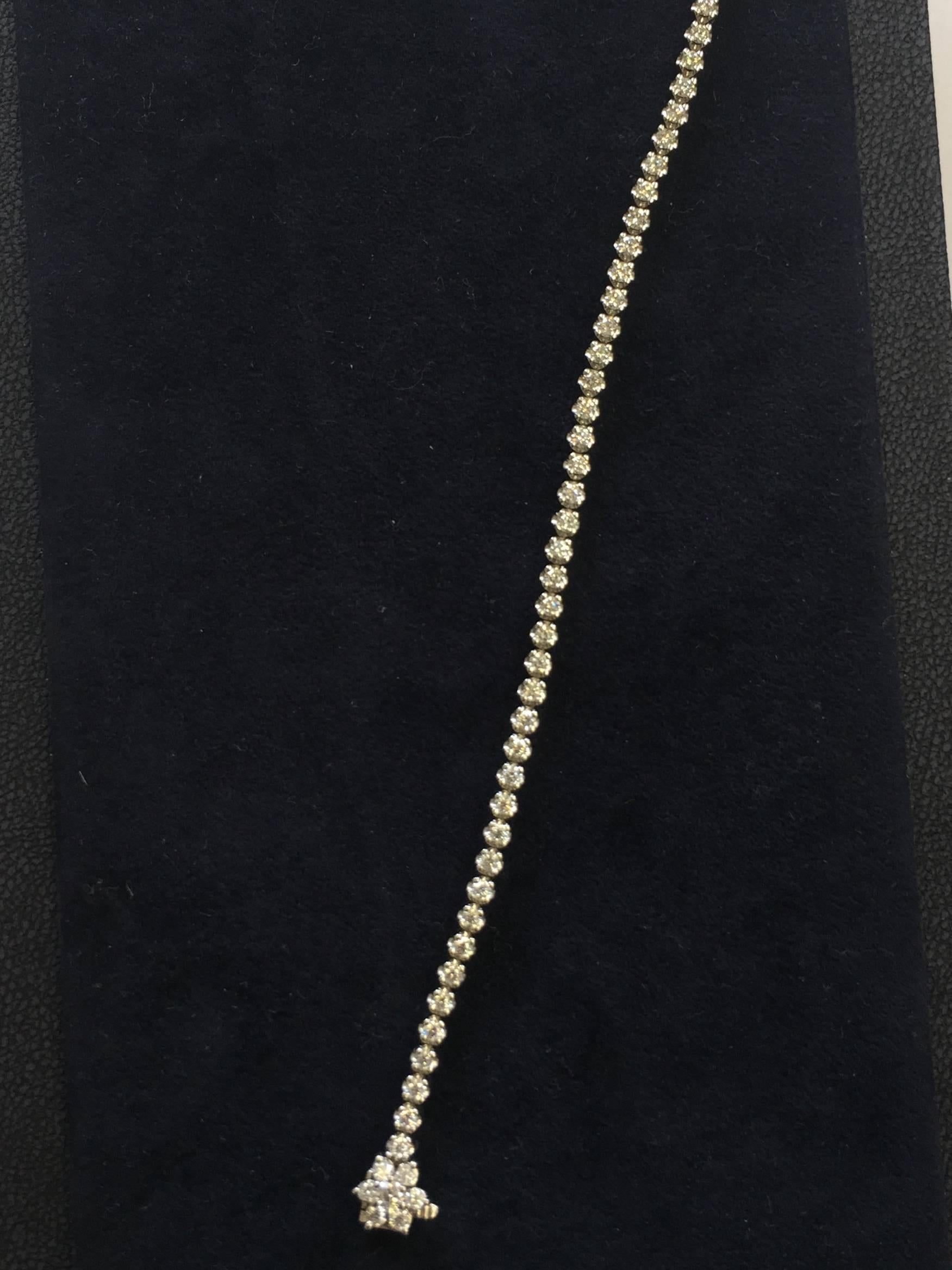 Round Cut 3 Carat Diamond Tennis Bracelet with a Flower Clasp  For Sale