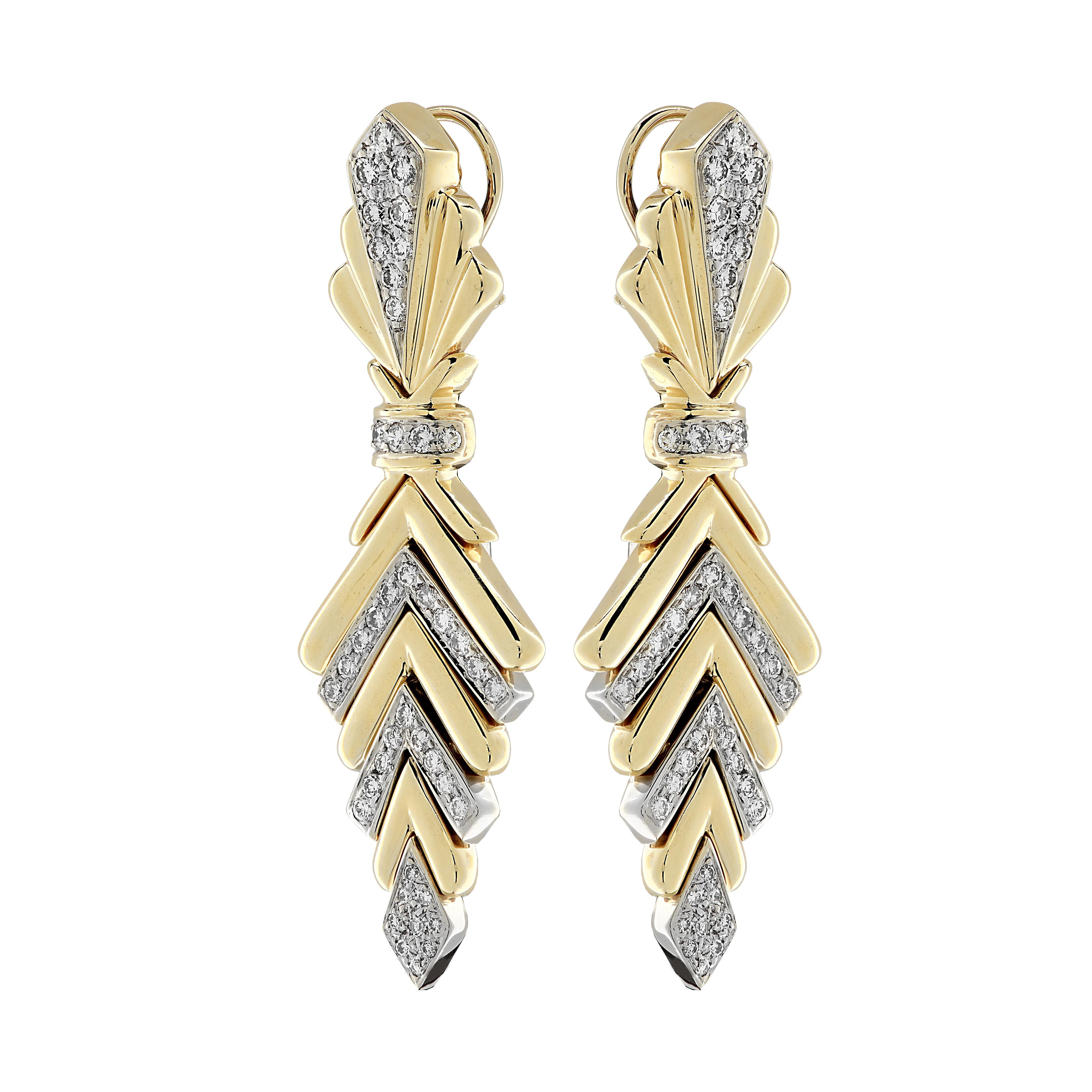 Striking clip-on dangle earrings crafted in yellow and white gold, featuring 90 round brilliant cut diamonds weighing approximately 3 carats total, F-G color, VS clarity. These stunning earrings measure 2.65 inches in length and .86 inches at its
