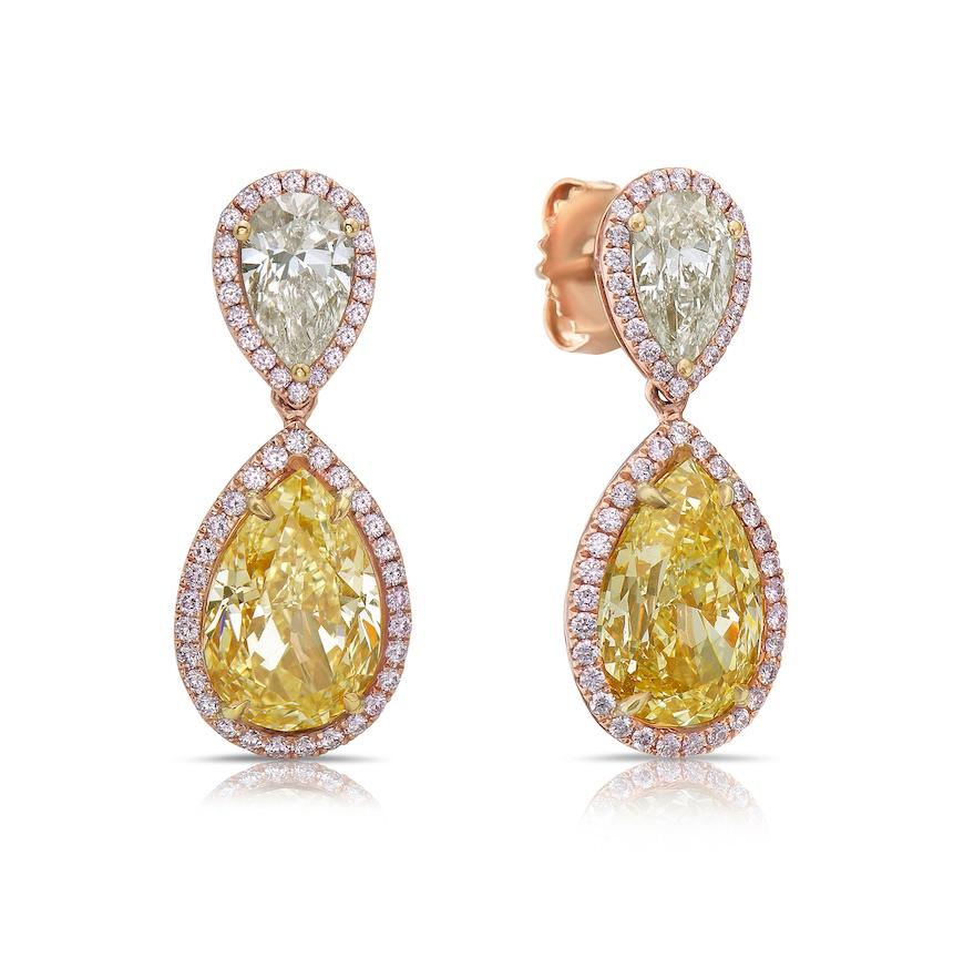 These 3 carat each light yellow pear-shaped diamond drop earrings are a breathtaking combination of elegance, artistry, and rare beauty. At the heart of each earring is a stunning 3.01 carat and 3.03 carat light yellow diamond, carefully chosen for
