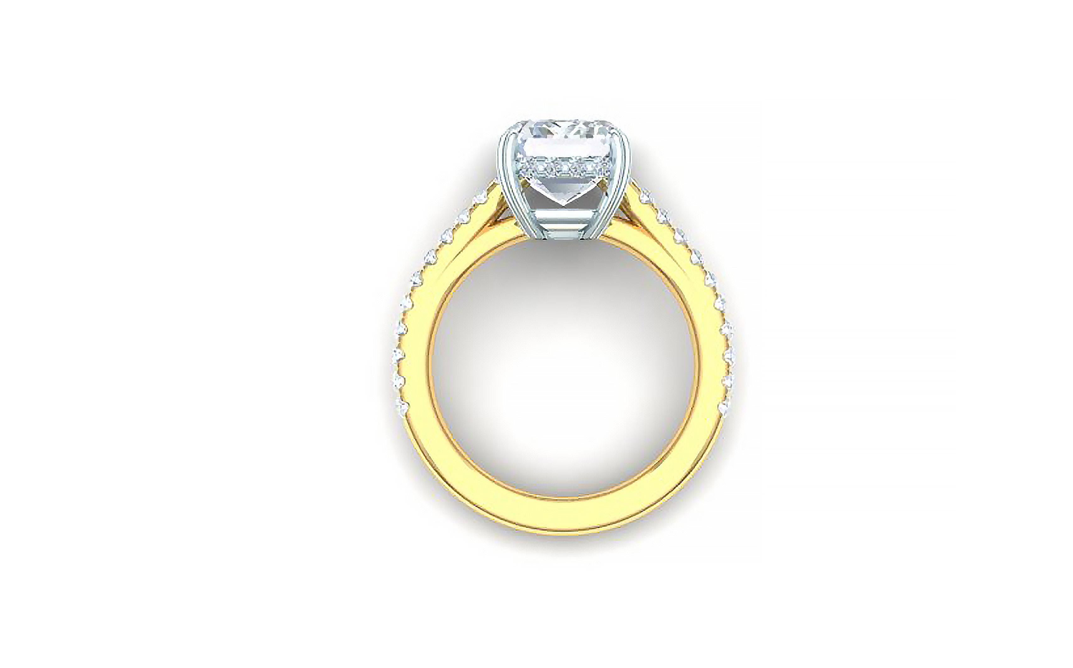 This classic and beautiful diamond ring has a 2 carat GIA certified G-VS2 Emerald cut diamond centered and over one carat of round brilliant diamond set in the shank of the ring. This diamond ring is cast from both platinum and 18k yellow gold. The