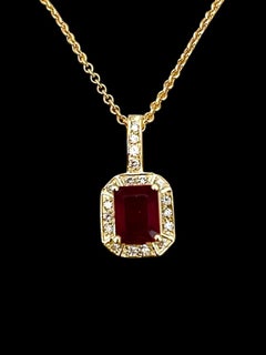 3 Carat Emerald Cut Ruby Pendant with Diamonds 14 Karat Yellow Gold Chain