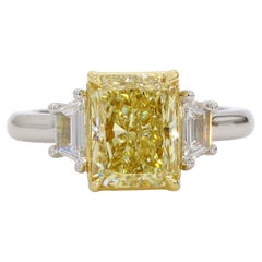 3 Carat Fancy Light Yellow Diamond Three-Stone Engagement Ring, GIA, Platinum.