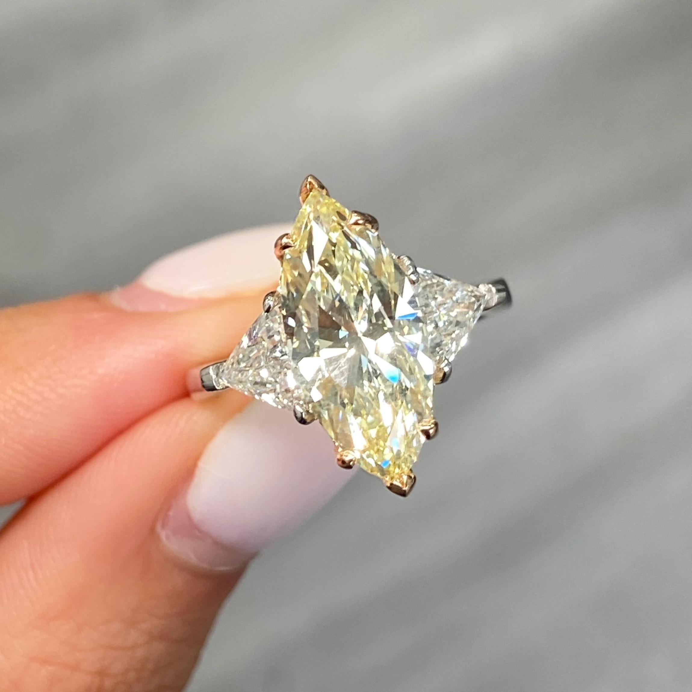 Marquise Cut 3 Carat Fancy Yellow Marquise Diamond Three Stone Ring For Sale