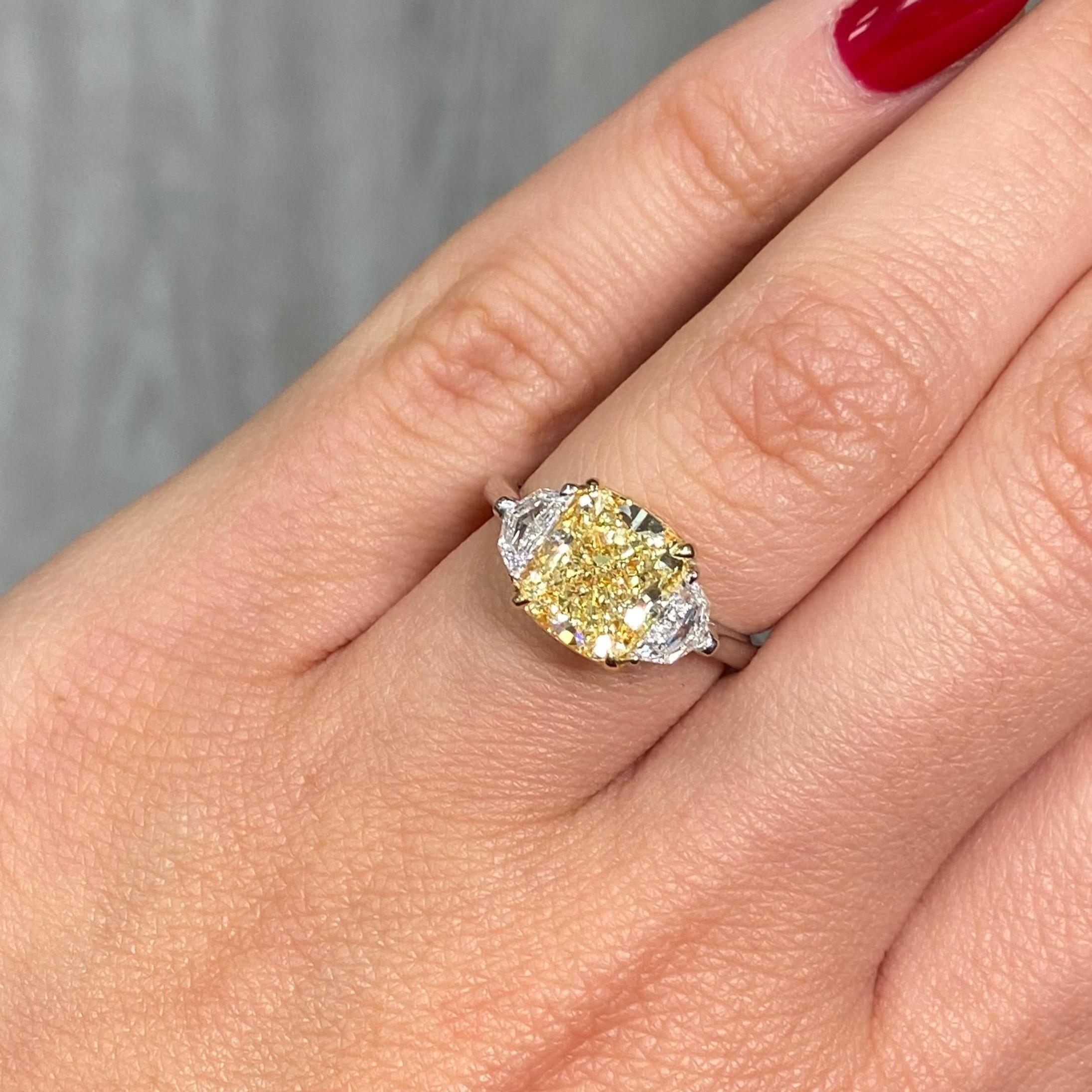 3 Carat Fancy Yellow VVS1 Cushion Cut Diamond Three Stone Ring In New Condition For Sale In New York, NY