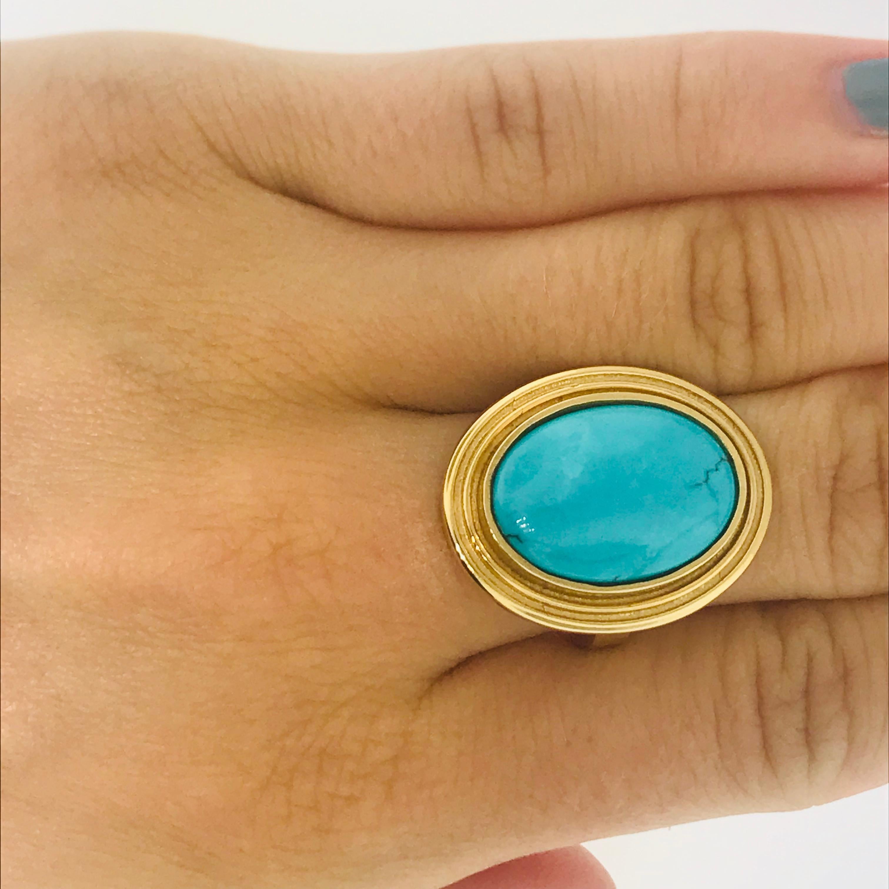 Persian Turquoise Ring-in stock only one
Custom Made by our jewelry artisian at Five Star Jewelry Austin, Texas
3.23 carat genuine oval Persian turquoise with natural veining in a 3.5 mm wide bezel setting
The ring has a 2.8 mm wide band 
The ring