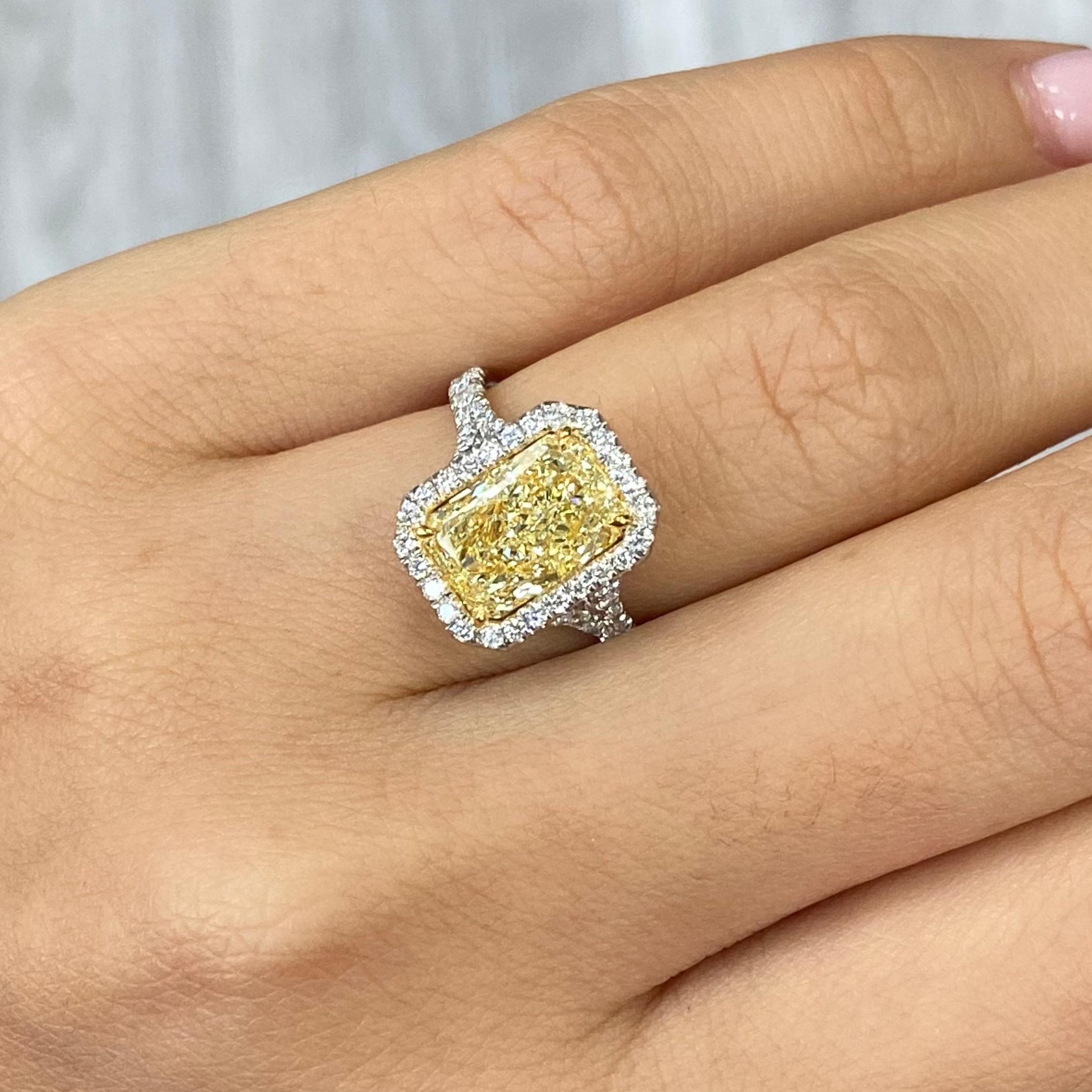 3.00 Carat 
Light Yellow (U-V)
VVS1 Clarity 
Elongated Radiant Cut 
0.64 Carats of White Rounds 
GIA Certified Diamond 
Split Shank Design
Crafted in Platinum and 18k Yellow Gold 
Handmade in NYC 

This piece can be viewed before purchase in our