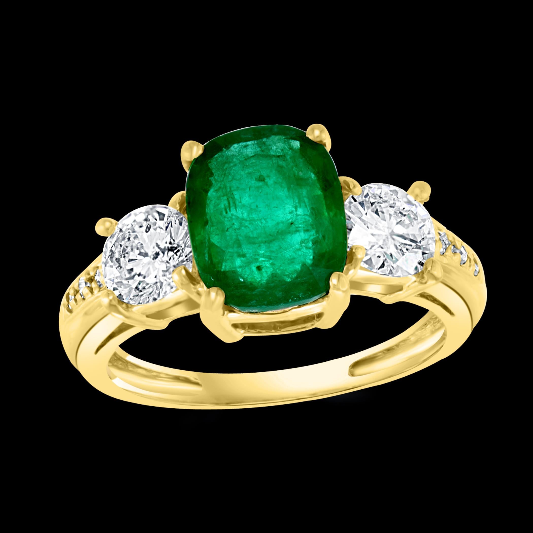 A classic, ring 
 3 Carat Natural Cushion Cut  Fine Emerald  from Brazil &  2 solitaire Diamond Ring 14 Karat Yellow  Gold Size 7
Intense green color, Beautiful stone with shine and luster  
Emerald has very nice color and hardly any inclusions .