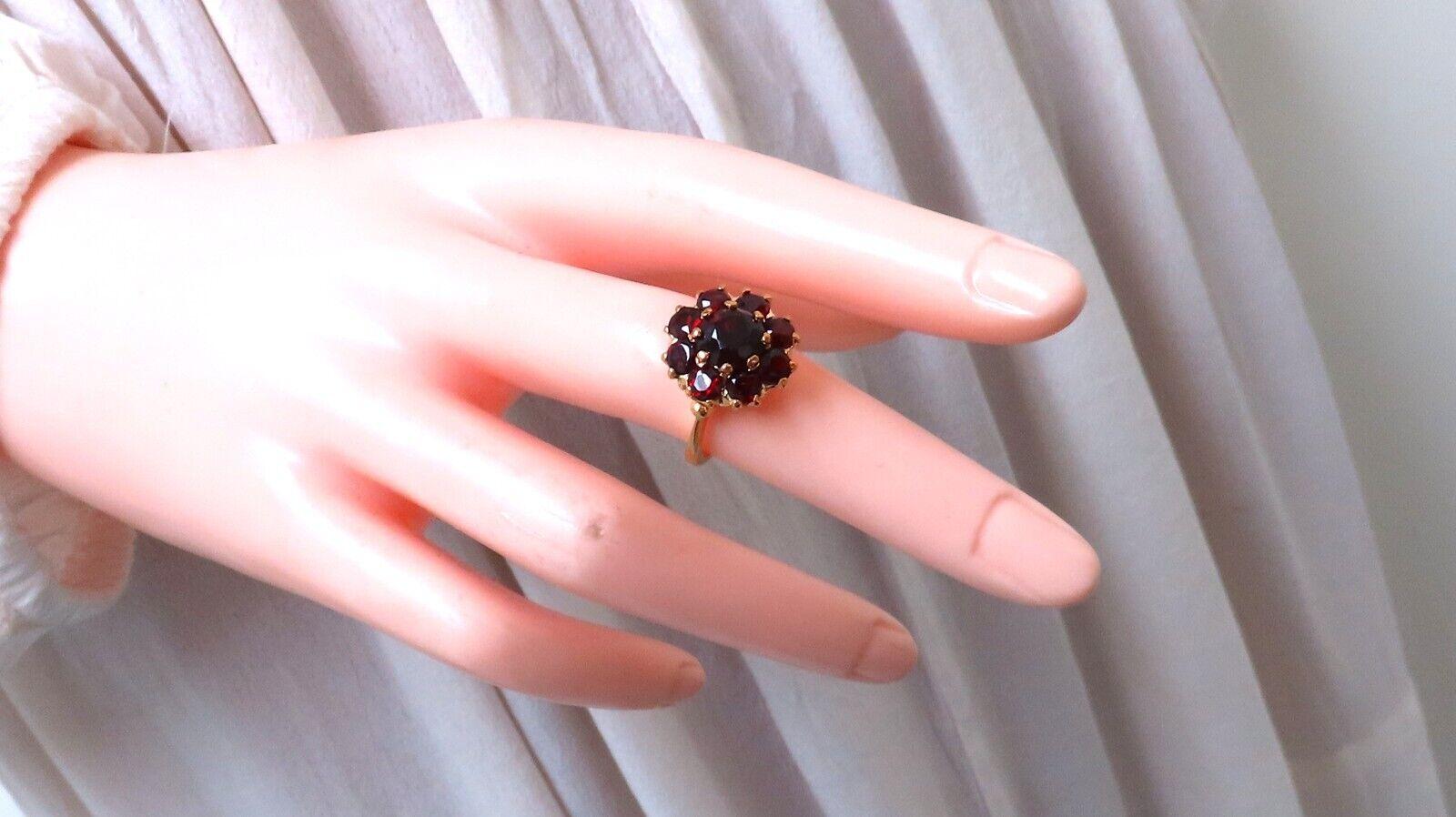 3 carat natural round-shaped garnets cluster ring.

Clean clarity, crimson red colors.

Deck of ring 15 mm

Depth of ring 7.7 mm

18 karat yellow gold, 5 g

Current size 5.5 and we may resize, please inquire.