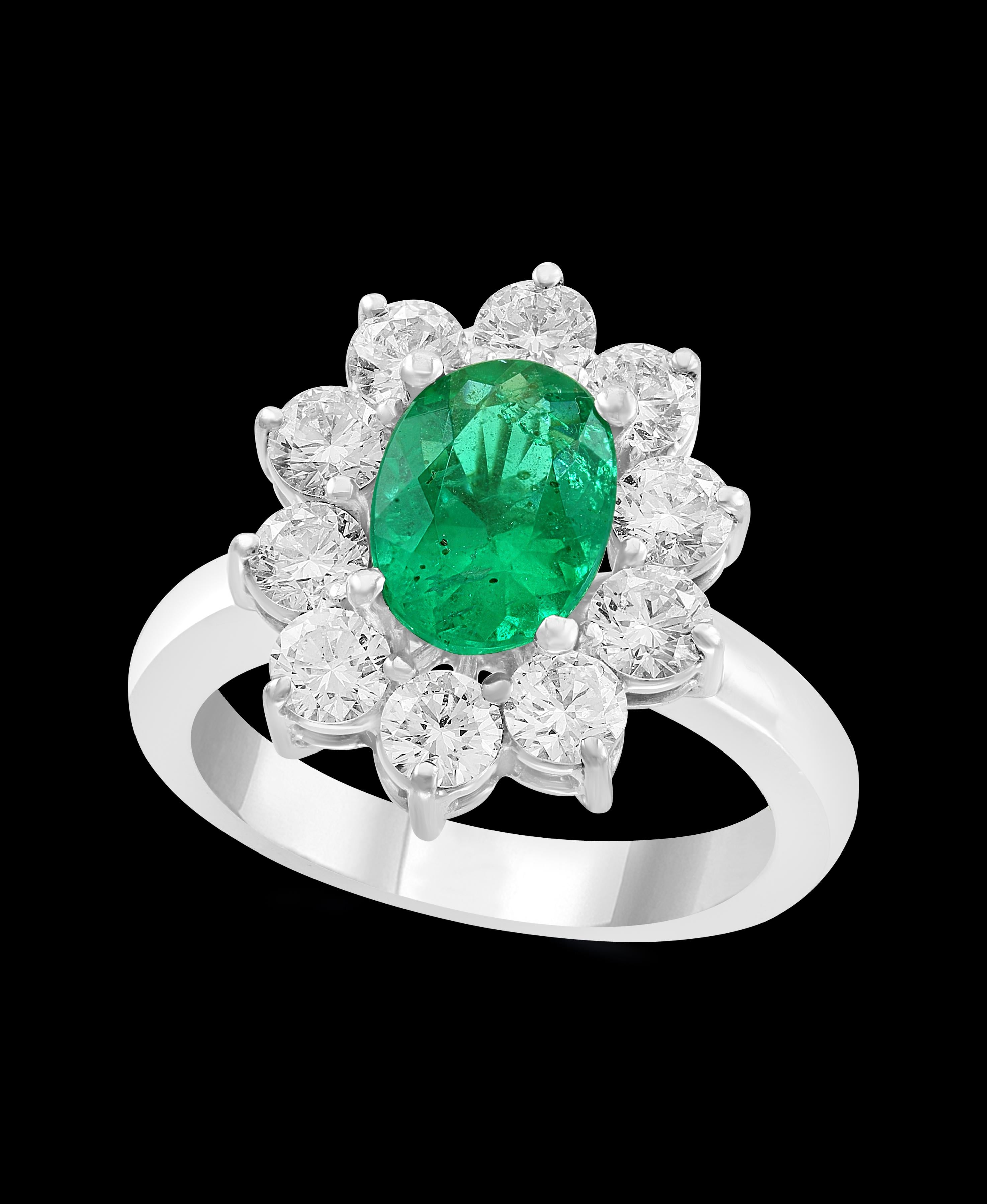 A classic, Cocktail ring 
3 Carat Colombian Emerald and Diamond Ring, Estate with  no color enhancement.
Gold: 18 carat White  gold 
Weight: 10 gram
 Diamonds: approximate 2.0 Carat 
Emerald:  3.0 Carat 
Origin : Colombia 
Color: Deep  Green,