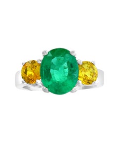 3 Carat Oval Cut Colombian Emerald and Yellow Sapphire 18 Karat Gold Ring