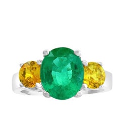 3 Carat Oval Cut Colombian Emerald and Yellow Sapphire 18 Karat Gold Ring