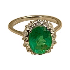 3.5 Carat Oval Cut Emerald 
Diamond Ring in 18 Karat White Gold