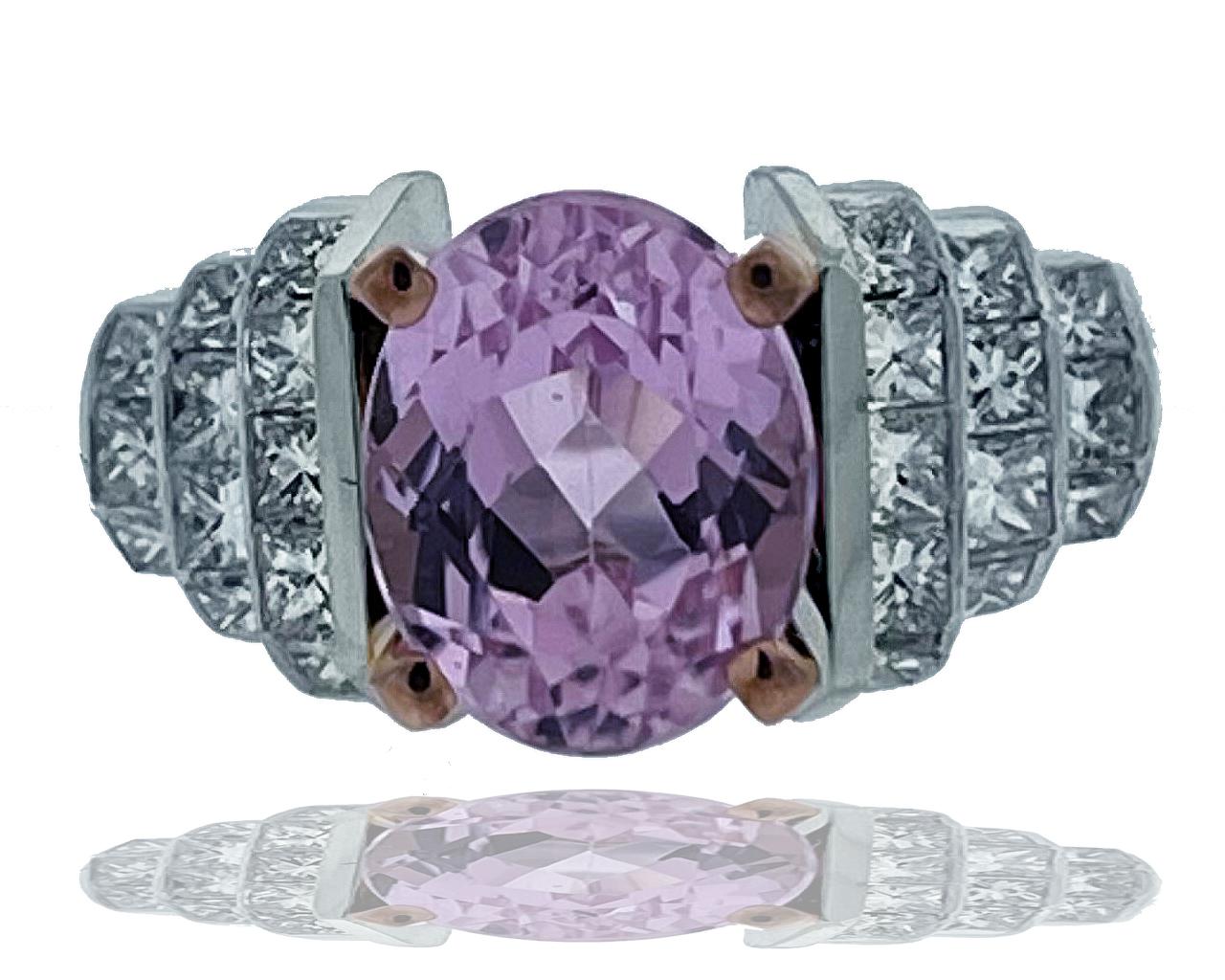 This stunning diamond and Kunzite ring have a gorgeous mix of cool pink tones and white diamonds.  The center is an oval cut Kunzite which weighs approx. 3 carats and sits in a rose gold head.  The shank of this ring has twenty-four princess cut