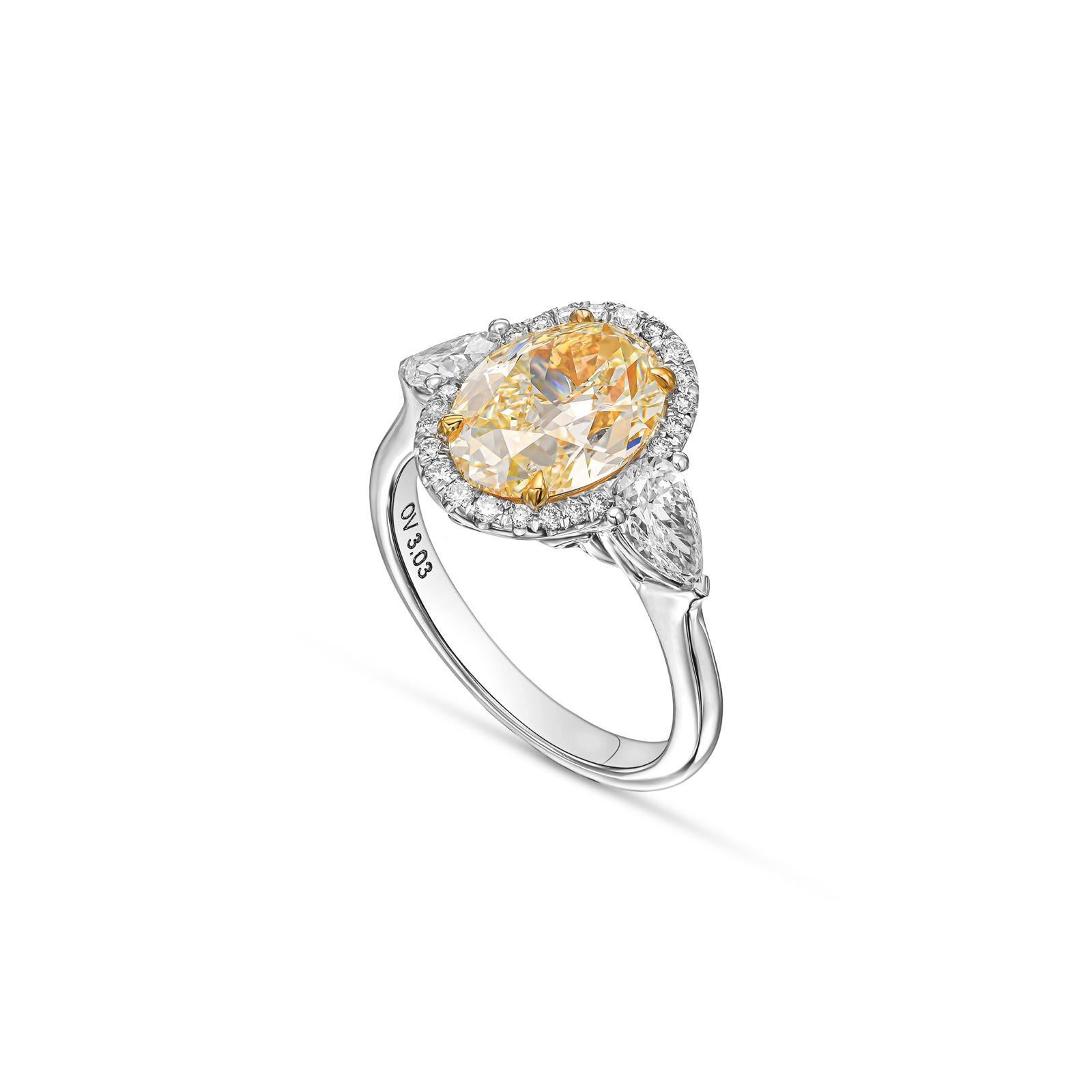 Contemporary 3 Carat Oval Yellow Diamond, Engagement Three Stones Halo Ring, IGI Certified. For Sale