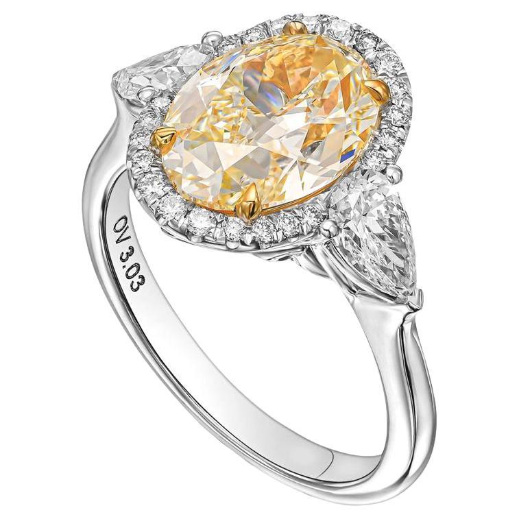 3 Carat Oval Yellow Diamond, Engagement Three Stones Halo Ring, IGI Certified.