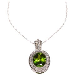 3 Carat Peridot 0.42 Carat Diamond 14 Karat Gold Halo Pendant Fashion Jewelry