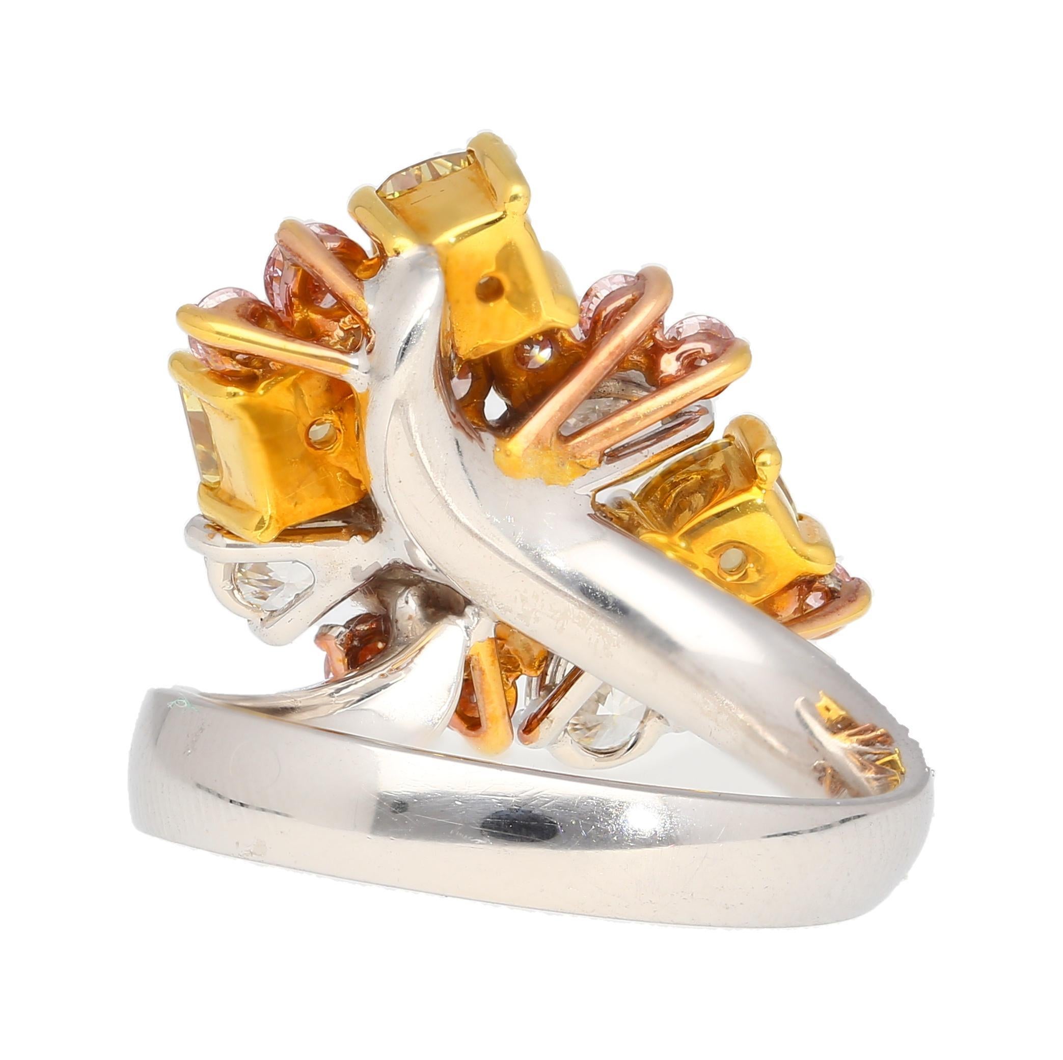 Pink, Yellow, White Multi Cut Diamond Platinum 950 & 18K Gold Ring. 

This cocktail ring is crafted from platinum 950 and 18k yellow gold. The shank is designed with a freeform style. The ring features a multitude of diamond gemstones. There are 4