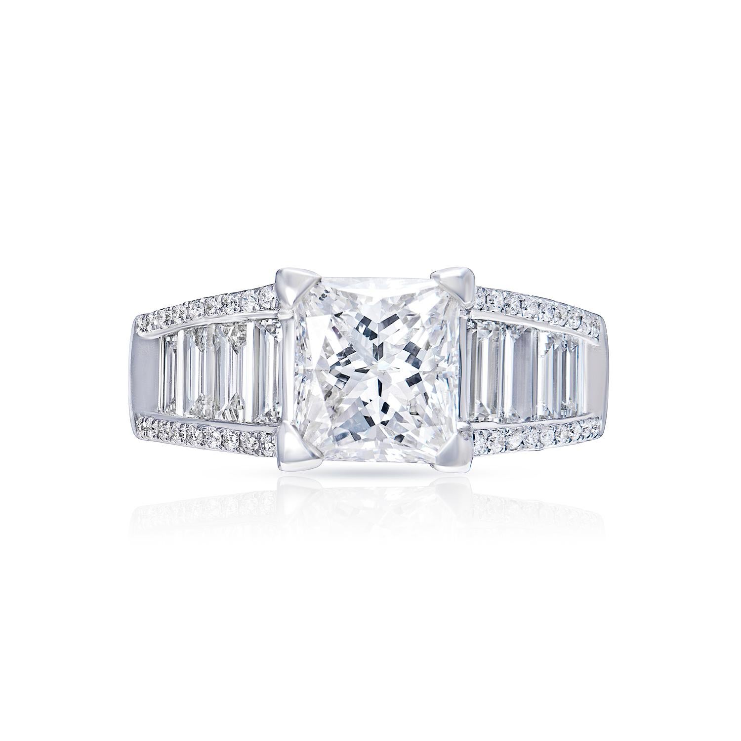 Center Earth Mined Diamond:
Carat Weight: 2.06 Carats
Color: G
Clarity: VS2*
Style: Princess Cut

*Feather Filled. Grades based on appearance after clarity enhancement 

EGL international certificate

Ring:
Total Carats:3.21 Carats
Metal: 18 karat