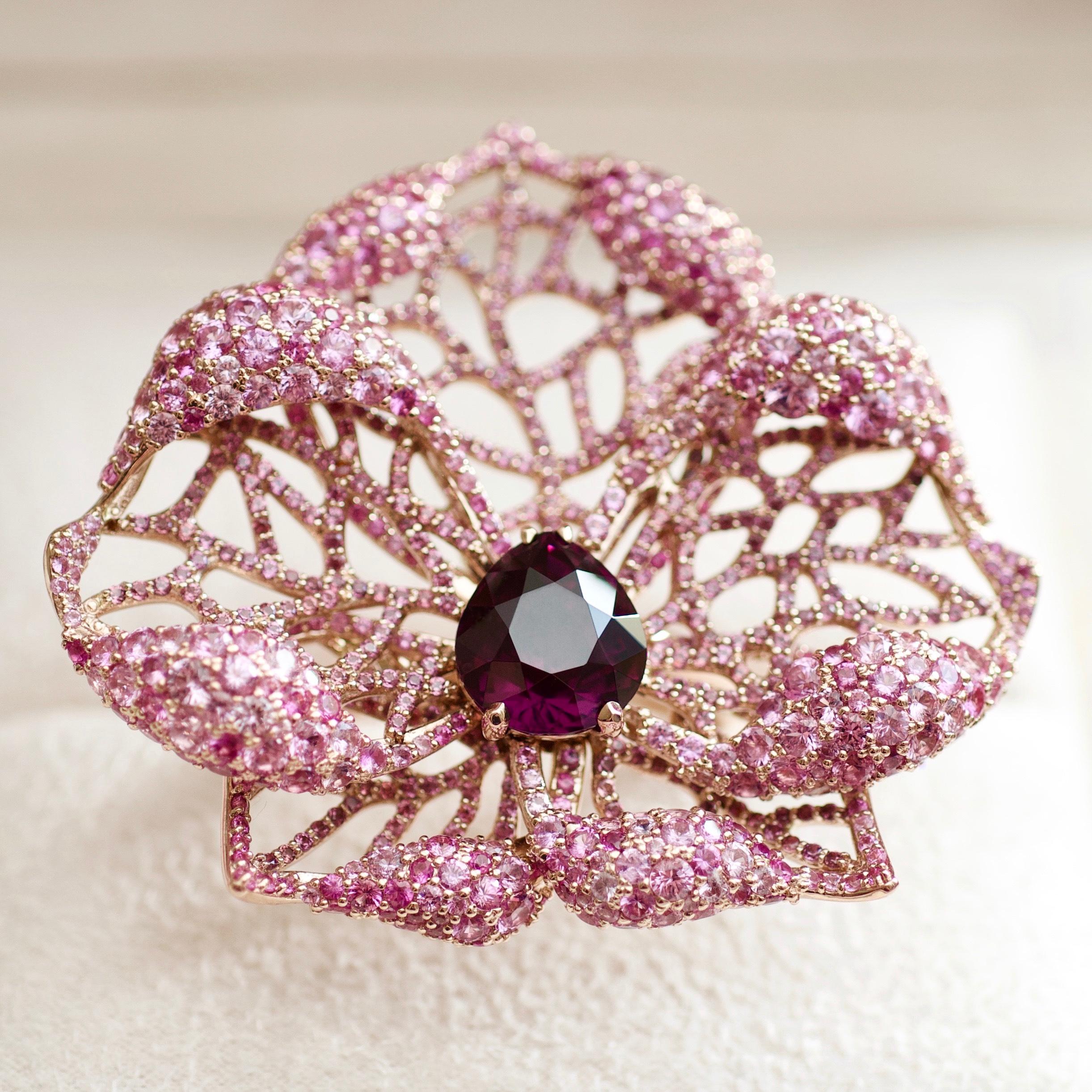 This cocktail ring belongs to our High Jewelry Collection.
It is one of a kind rose gold ring with noble spinel set together with rose pave. 
It looks like a real flower and it instantly attracts the attention. 
The main idea of the design is to