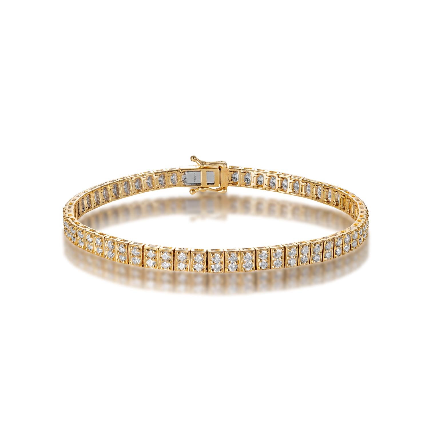 Style: Diamond Tennis Bracelet
Diamonds
Diamond Size: 3.44 Carats
Diamond Shape: Round Brilliant Cut

Setting: Miracle Set & Shared Prong
Metal: 14 Karat Yellow Gold
Clasp: Box catch with hidden safety

Total Carat Weight: 3.44 Carats