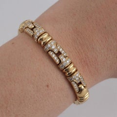 Armband mit Pavé-Verzierung aus 18-karätigem Gelbgold und einem runden Diamanten von 3 Karat