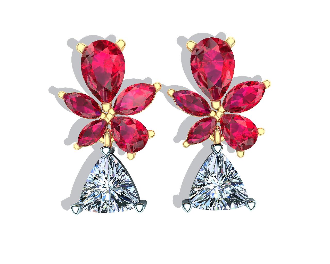 A proven design that shows the stunning contrast of rich ruby red set in yellow gold net to a cold crisp white diamond is seen in this pair of drop earrings. The center stone of each earring measures approx. 5mm and has a carat weight of close to