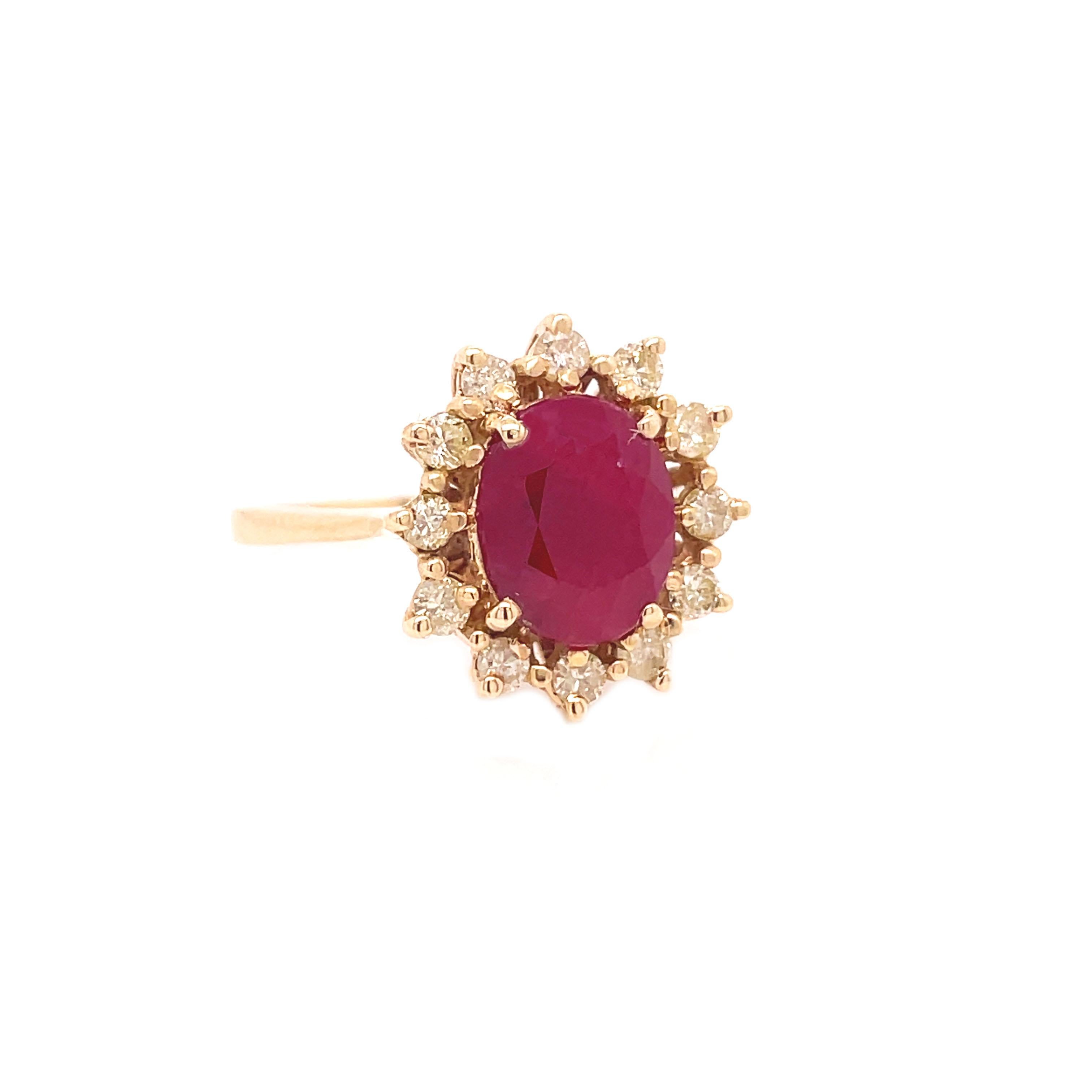This is a beautiful ring set in 14K yellow gold that features a delicious 3+ carat vibrant ruby complimented by glittering light fancy yellow diamonds. The warm yellow gold metal paired with the rich and vibrant ruby creates a firey harmonious