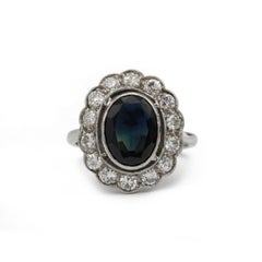 Bague Marguerite en or blanc 18 carats, sertie d'un saphir de 3 carats et de diamants