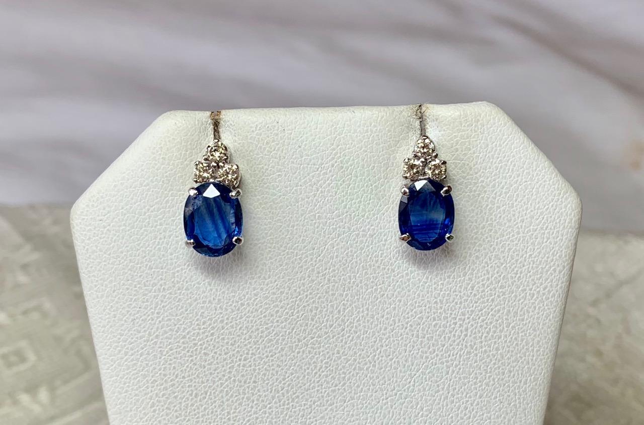 A gorgeous pair of 3.18 Carat Sapphire Diamond Stud Earrings.  The perfect wedding or engagement earrings which are also wonderful everyday or at the most glamorous affair!  The earrings feature a central Fine Blue oval faceted Sapphire.  The