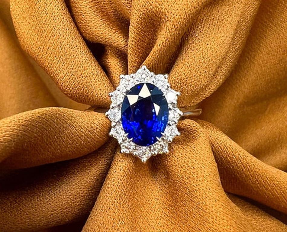 Sapphire Weight: 3.02 CTs, Measurements: 9x6 mm, Diamond Weight: 0.36 CTs (2mm), Metal: 18K White Gold, Gold Weight: 4.55 gm, Ring Size: 7, Shape: Oval, Color: Royal Blue, Hardness: 9, Birthstone: September