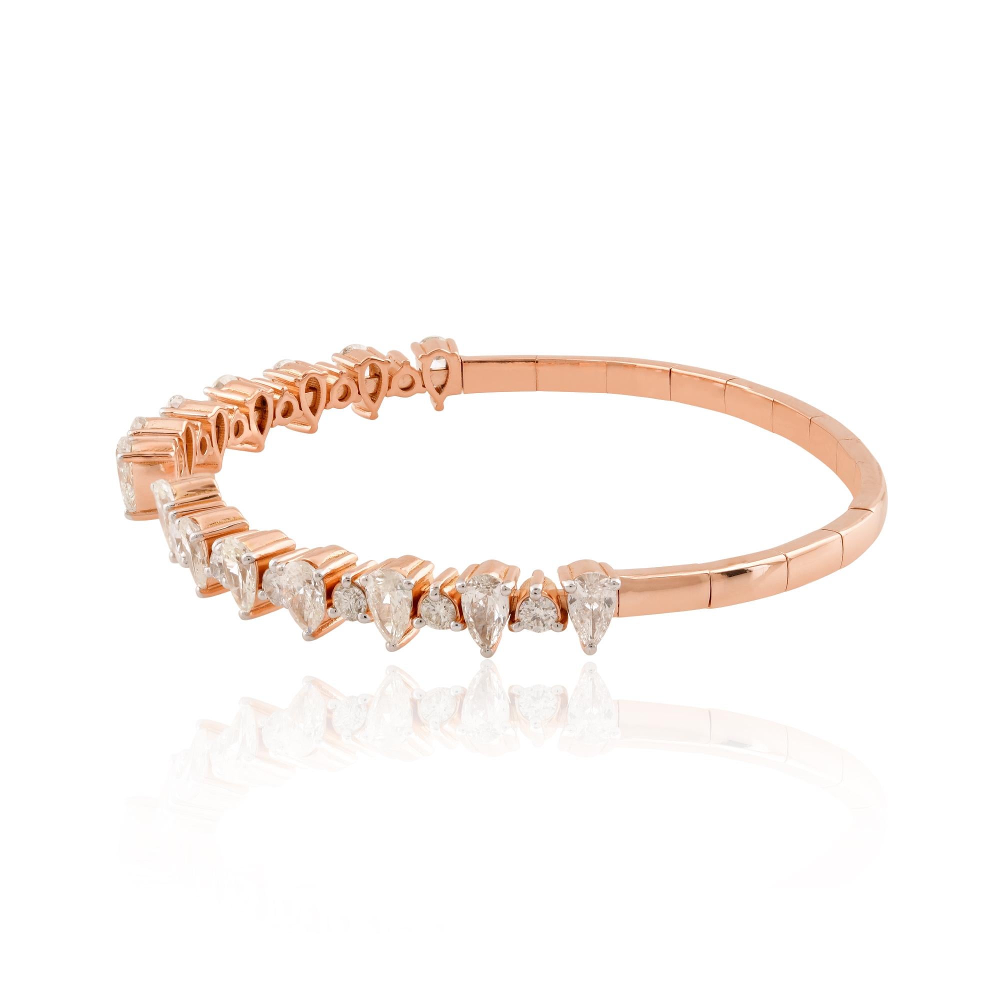 Every facet of this bangle bracelet has been meticulously crafted to perfection, from the smooth, polished finish of the gold to the secure setting of the diamond. The open cuff design not only adds a modern twist to the classic silhouette but also