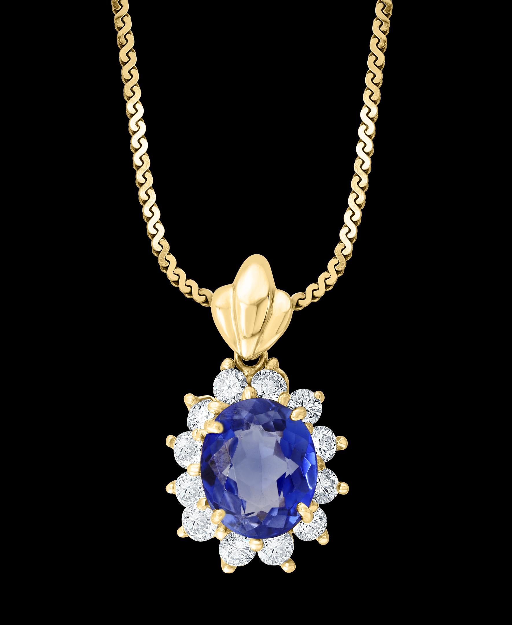 3 Carat Tanzanite and 1 Ct Diamond  Pendant or Necklace 14 Karat  Yellow Gold
Tanzanite Weight  approximately 3  Carats, very good  quality of Tanzanite , very fine desirable blue color .
12 Brilliant cut diamonds of high quality are surrounding the