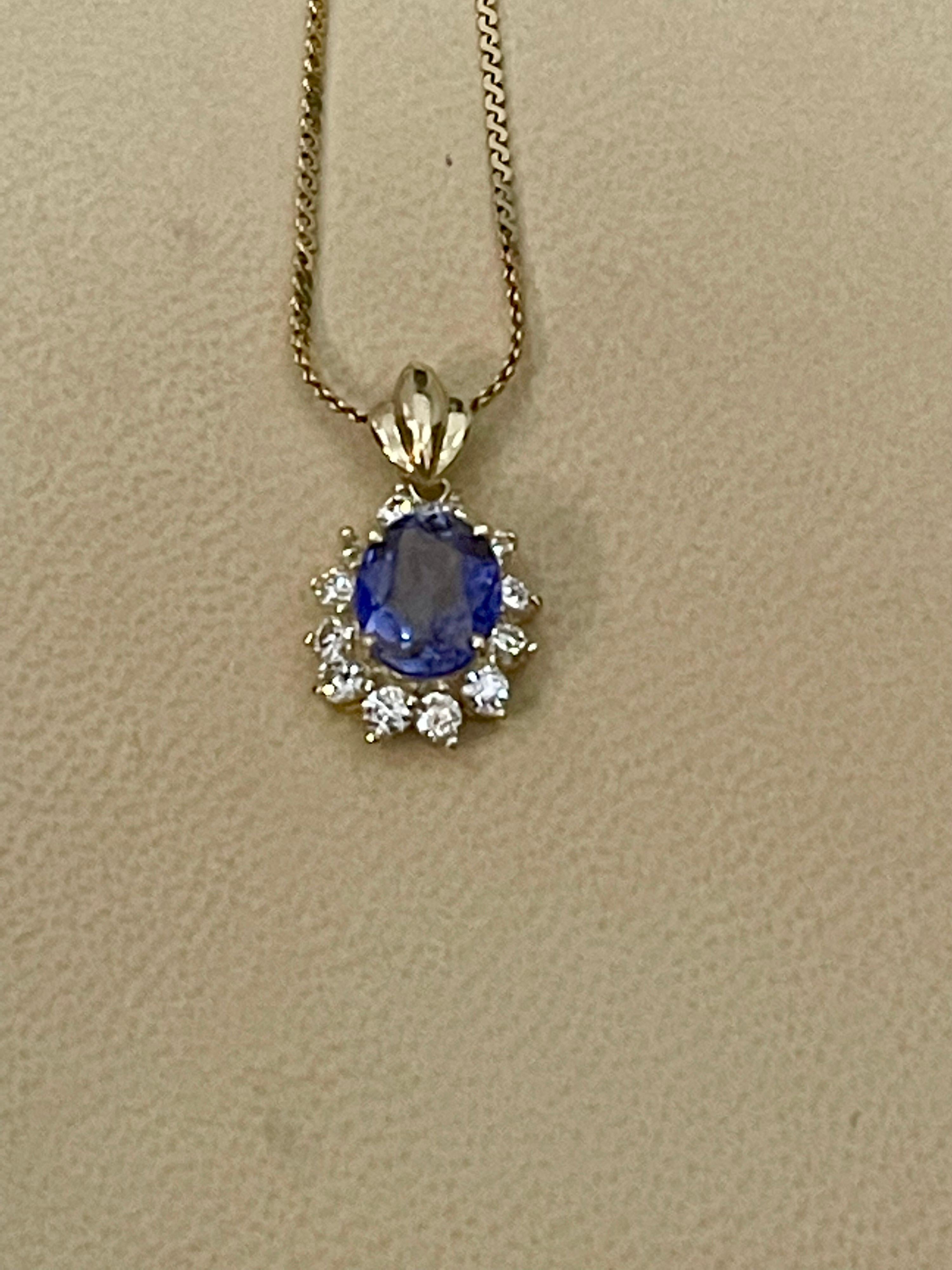 Oval Cut 3 Carat Tanzanite and 1 Ct Diamond Pendant or Necklace 14 Karat Yellow Gold For Sale