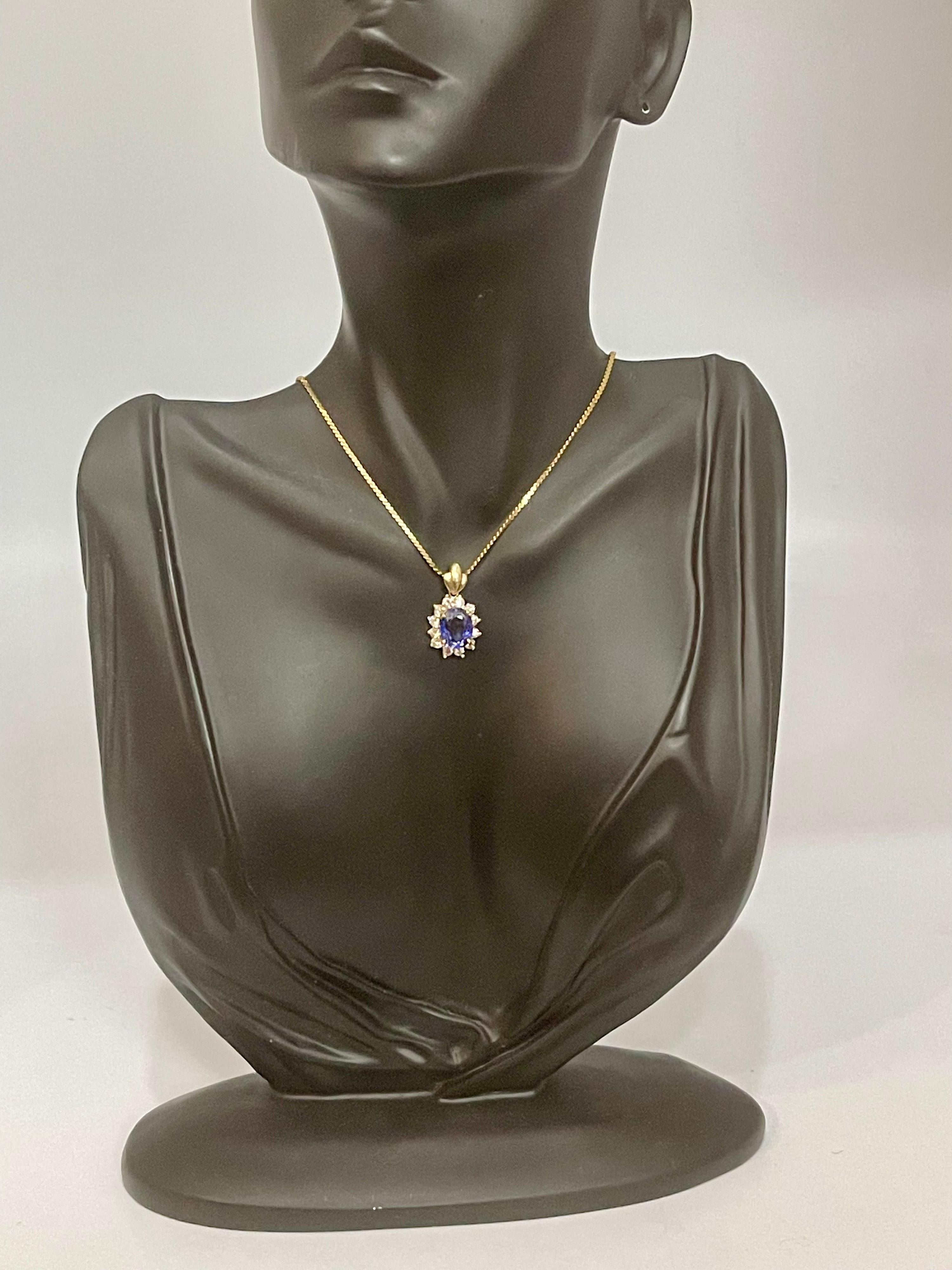 Women's 3 Carat Tanzanite and 1 Ct Diamond Pendant or Necklace 14 Karat Yellow Gold For Sale