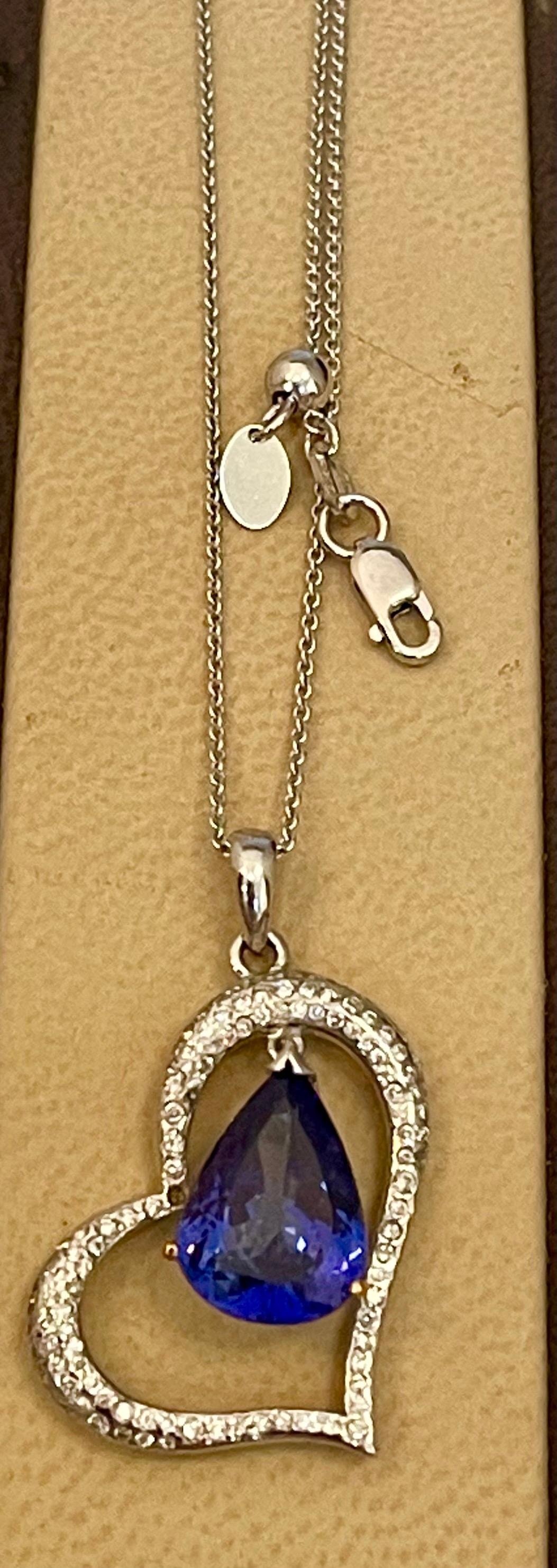Pear Cut 3 Carat Tanzanite and 2 Carat Diamond Heart Pendant/ Necklace 18 Karat Gold For Sale