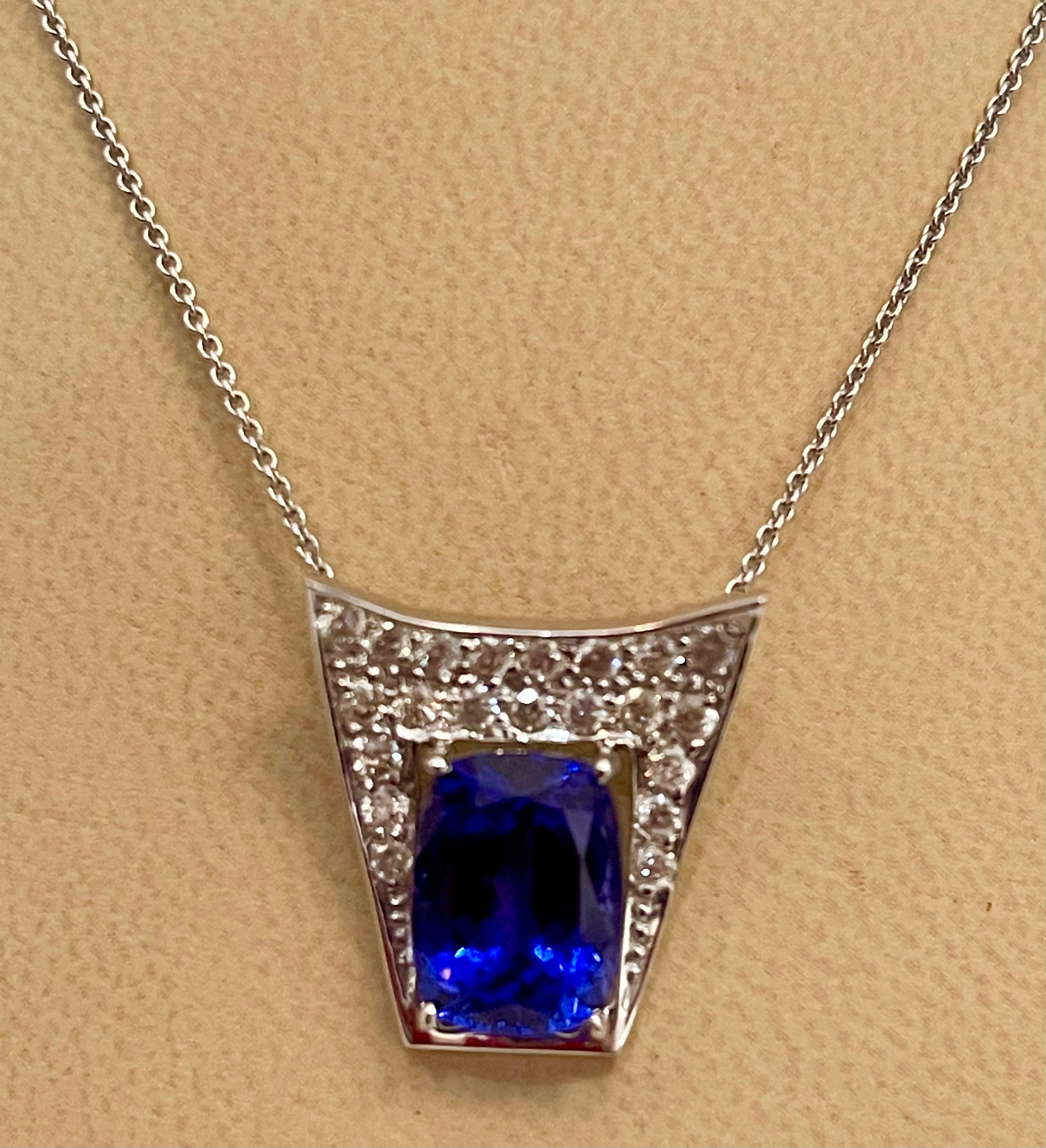 Pear Cut 3 Carat Tanzanite and 2 Carat Diamond Heart Pendant/ Necklace 18 Karat Gold For Sale