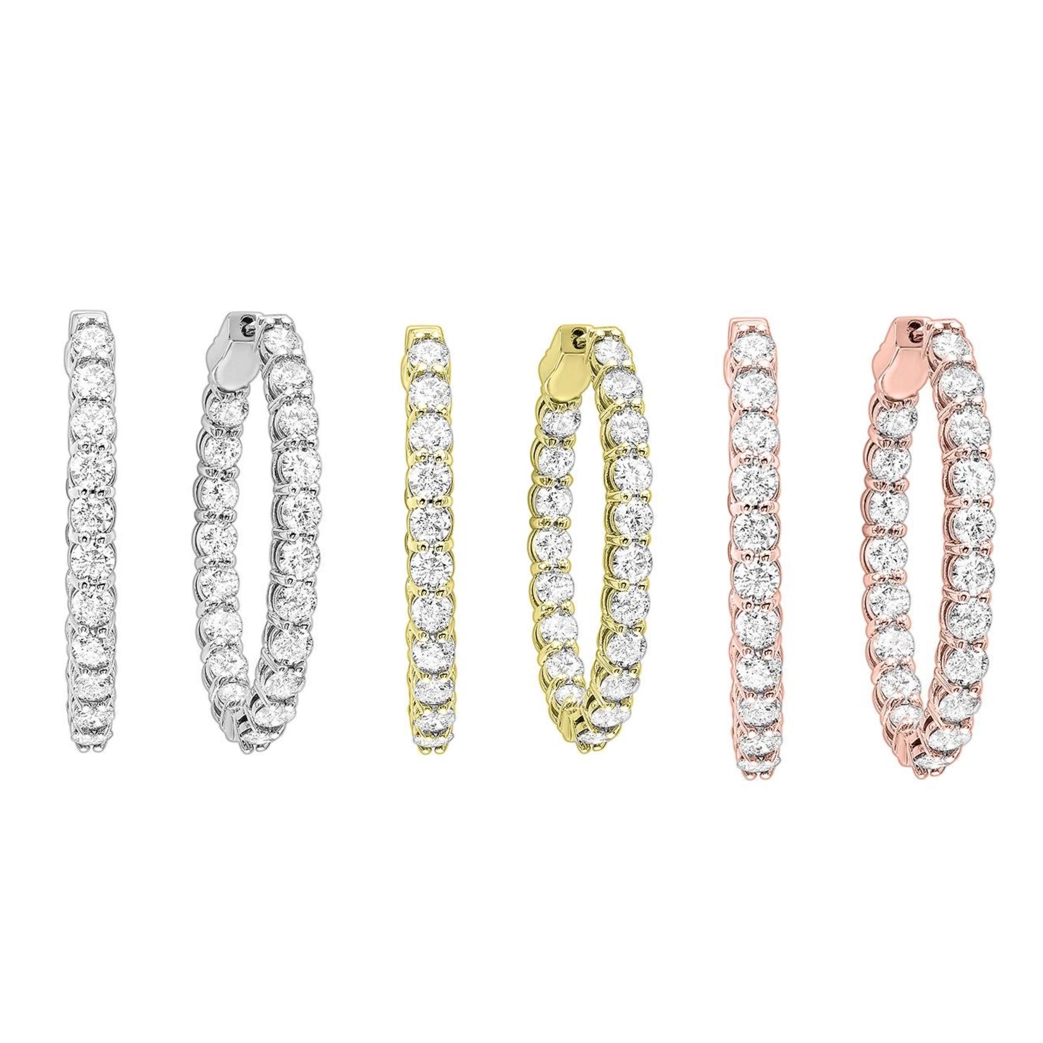 Nothing says luxury like an incredible pair of diamond hoop earrings. These stunning brightly polished 14 karat yellow gold inside out oval-shaped hoop earrings feature a total of 42 round brilliant cut diamonds totaling 3.00 carats are prong set on