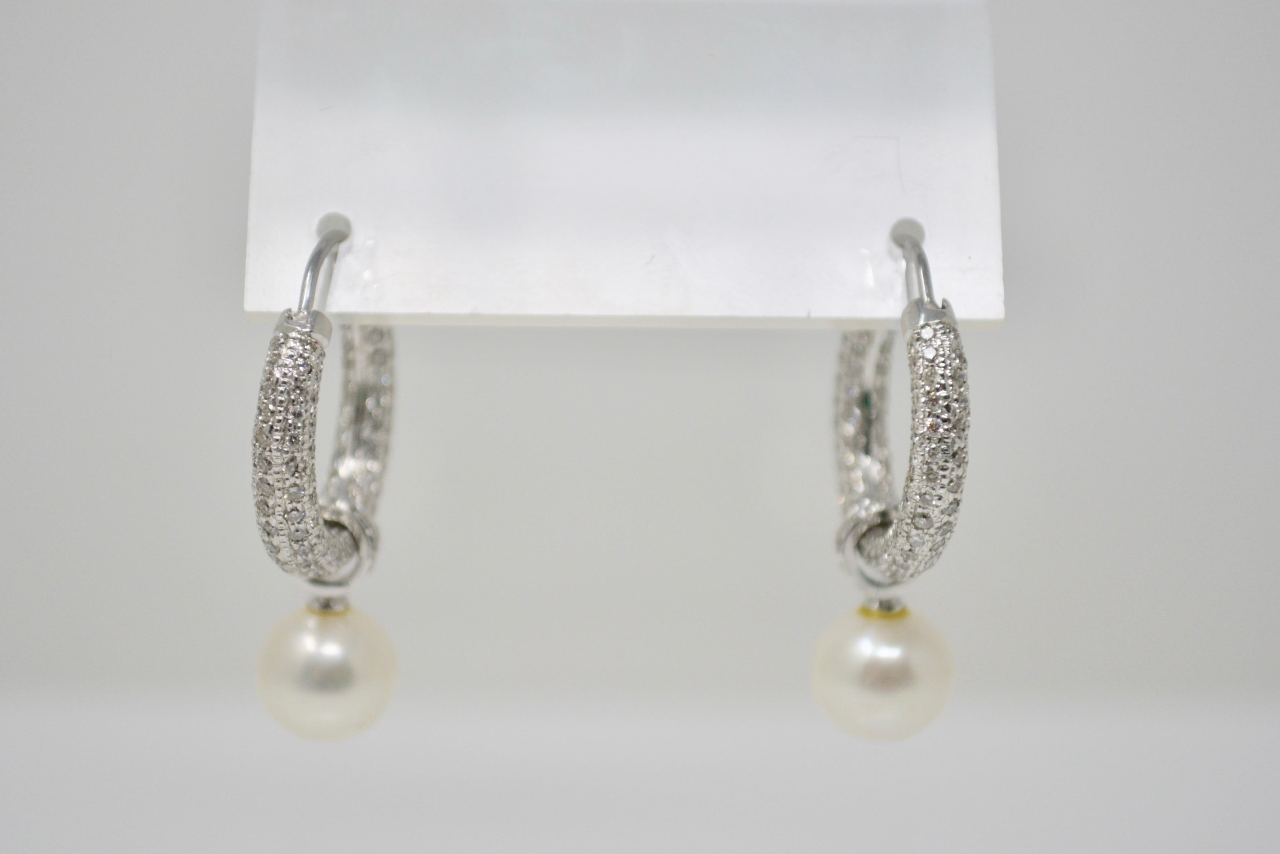 The pave set diamond hoop earrings with detachable diamond and south sea pearl drop weighs 3 carat total weight and the pearls are 9.8mm. Earrings can be worn with or without pearl. Pearls are a silver white with have a nice luster. These beautiful