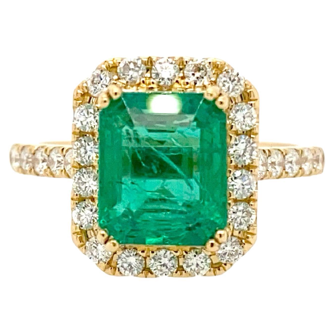 3 Carat Zambian Emerald And Diamond Halo Ring In 18k Yellow Gold For Sale