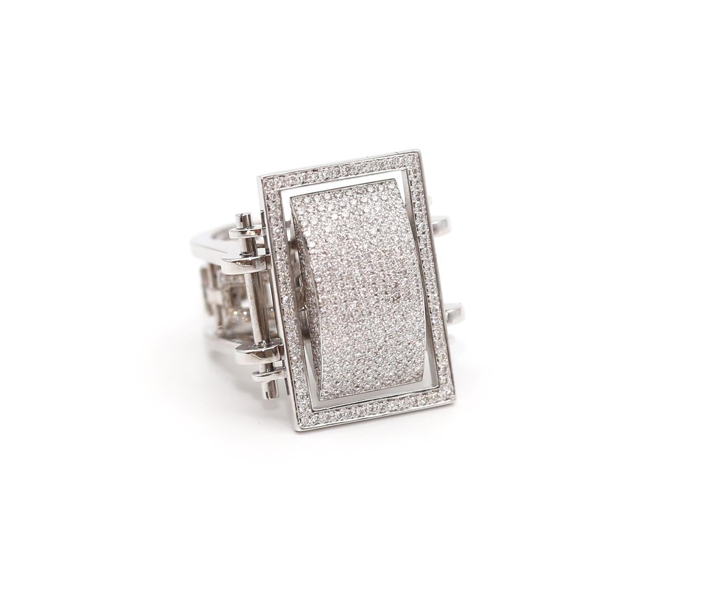 A true one-of-a-kind ring. With approximately 3 Carats of fine Diamonds finished in an 18K White Gold. Perfectly Geometrical design. Created in 200.

It is a bold statement of a ring. It will grab attention on any occasion. Could be worn daily yet
