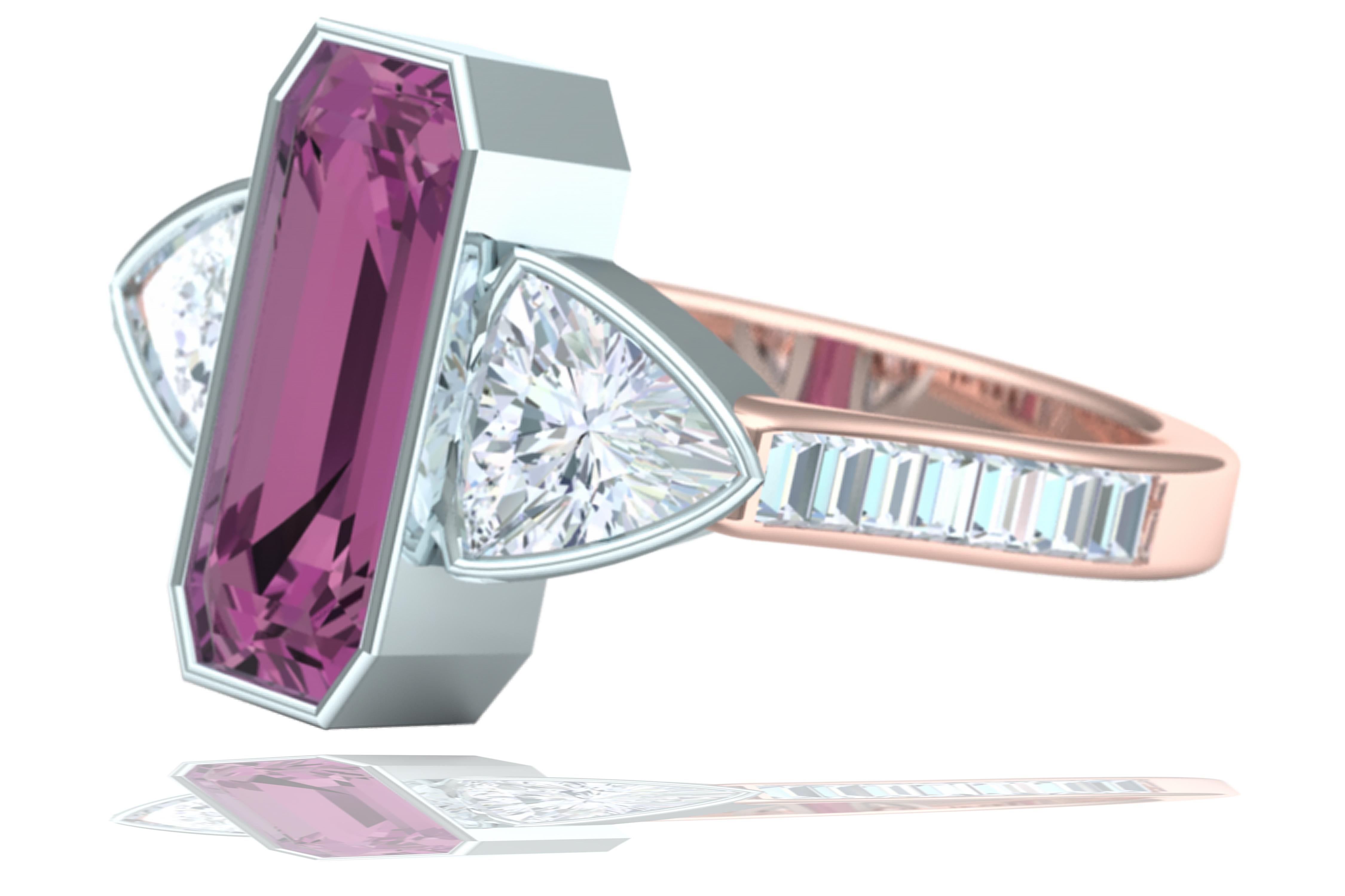 A custom cut center tourmaline can be seen in this ring.  The center stone weighs apprx. 1.5 carats and has two matching trillion cut diamonds that have a color and clarity of G-H VS-SI.  There are also another .35 carats of matching baguette cut