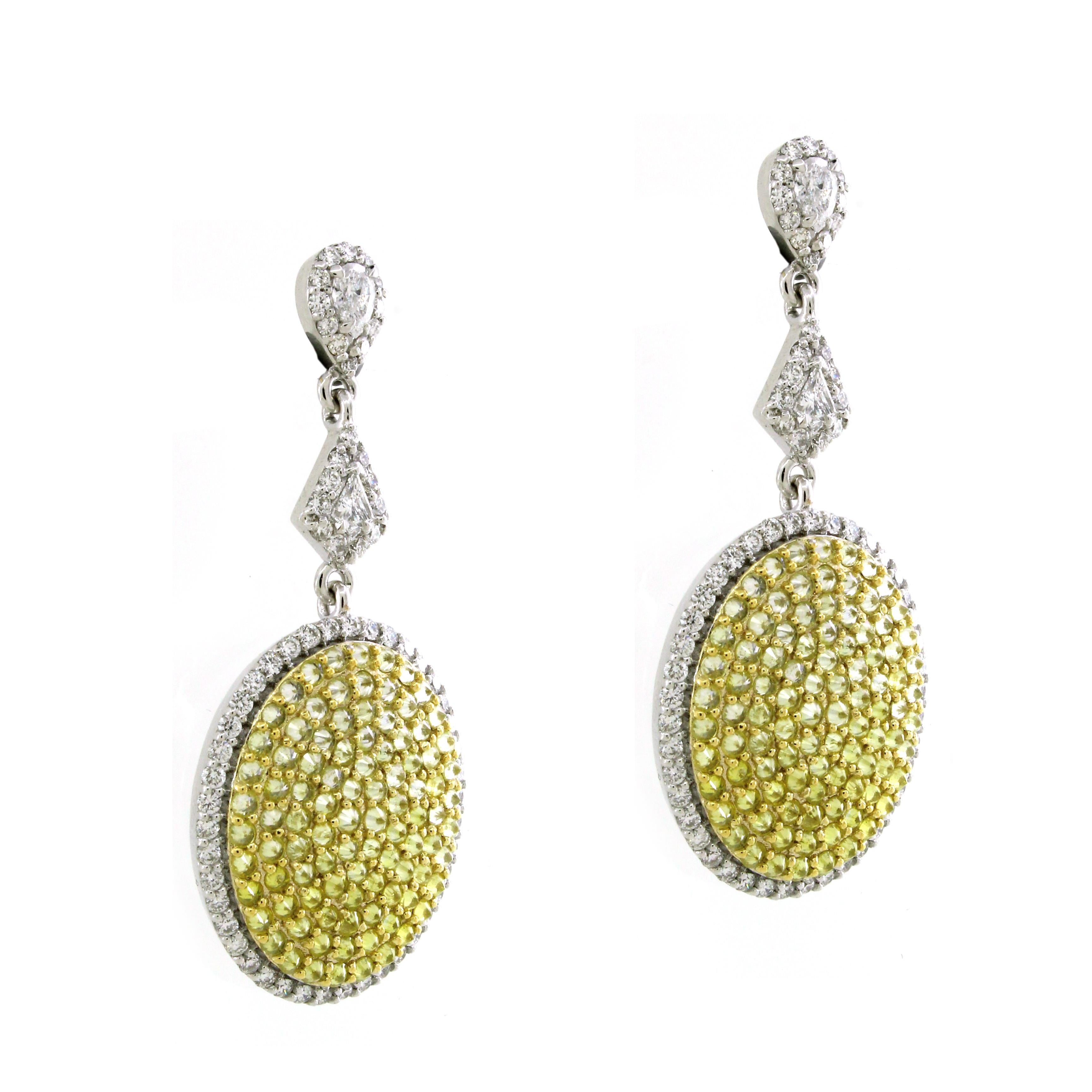 Introducing a pair of breathtaking dangling earrings that harmoniously blend classic elegance with a touch of modern extravagance.
At the heart of each earring, you'll find two mesmerizing white pear-cut diamonds, weighing total of 0.17 carats.