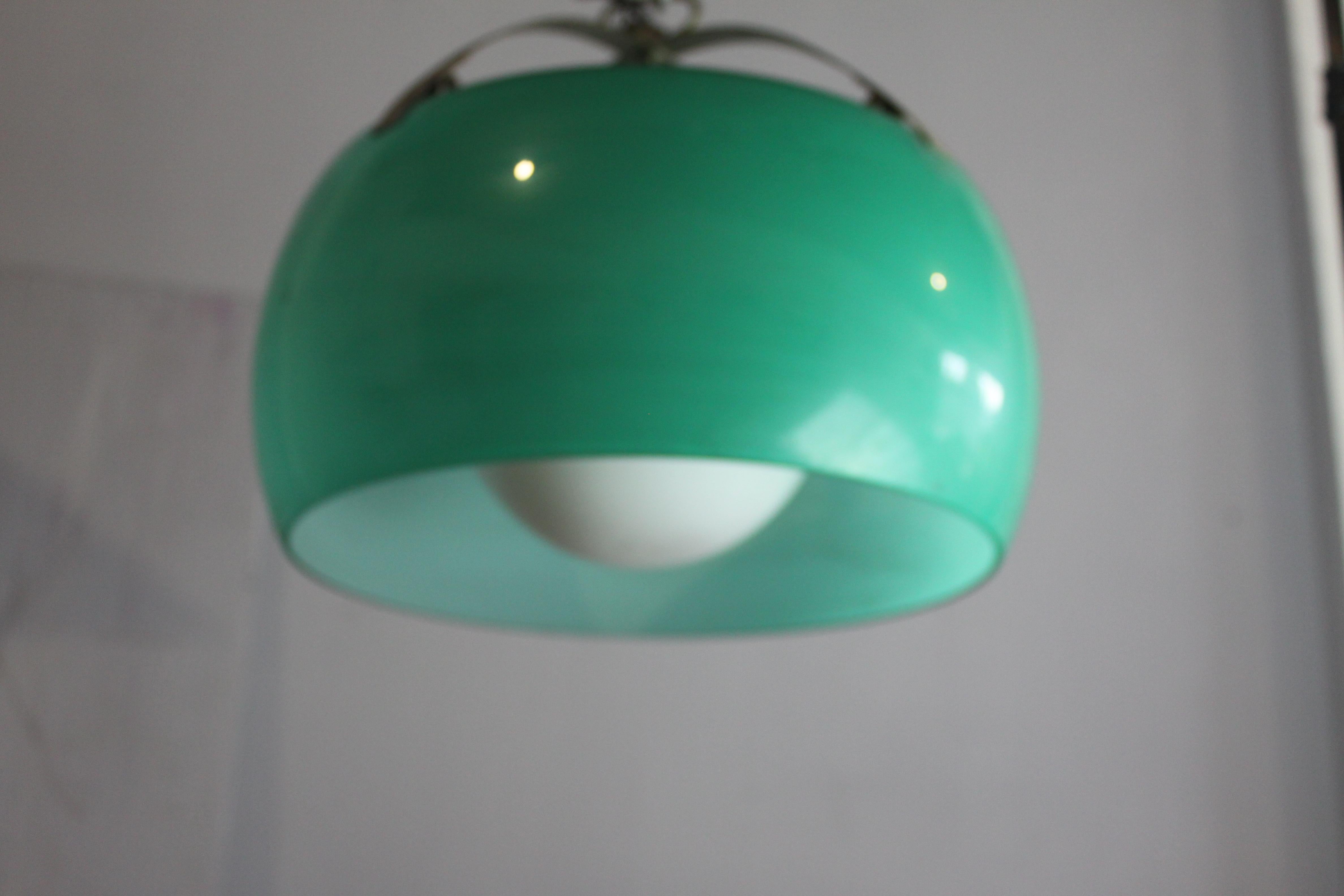  rare green The Omega lamp, in pendant and ceiling versions, is part of the first series of lamps designed by Vico Magistretti in the first 10 years of Artemide's history. The lamp features a diffuser (later also used in the Erse, Clitunno and